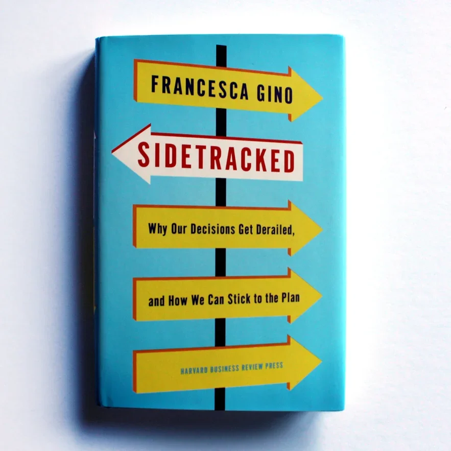 Book titled 'Sidetracked' by Francesca Gino, with a subtitle about decision derailment and sticking to plans, published by Harvard Business Review Press.