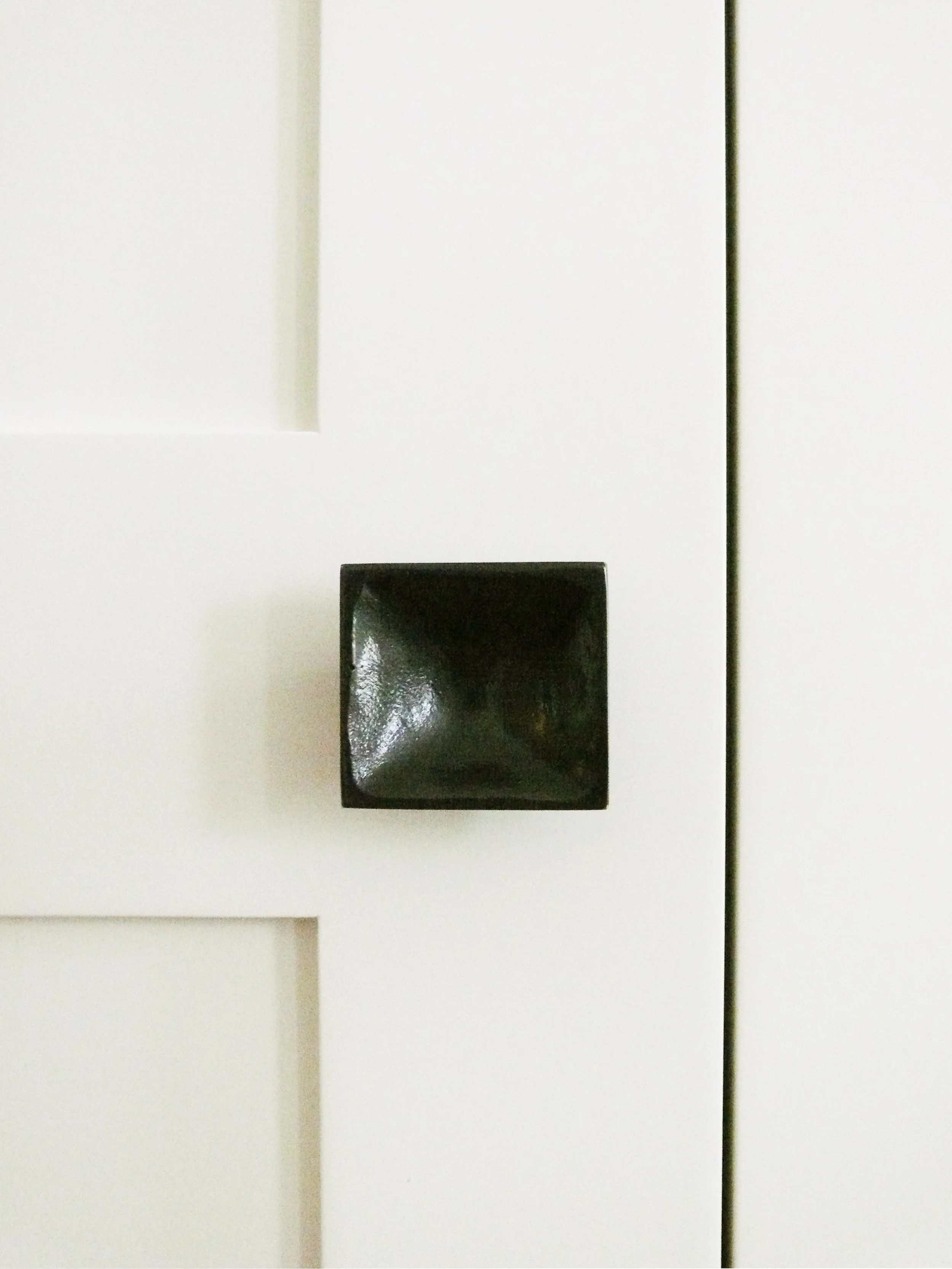 Bespoke joinery with bronze handle detail, living room Lennox Gardens apartment Knightsbridge