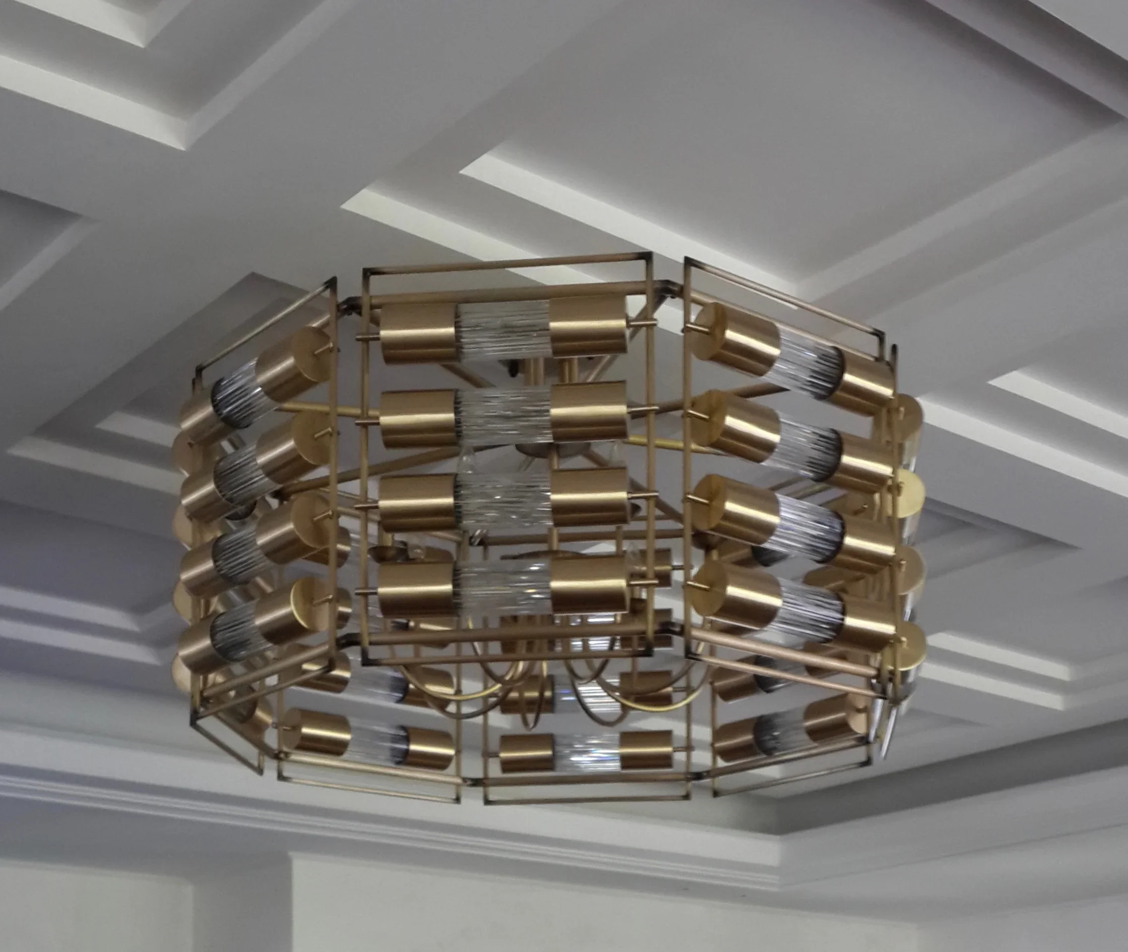 Bespoke brass and reeded glass chandelier, living room Bandung residence