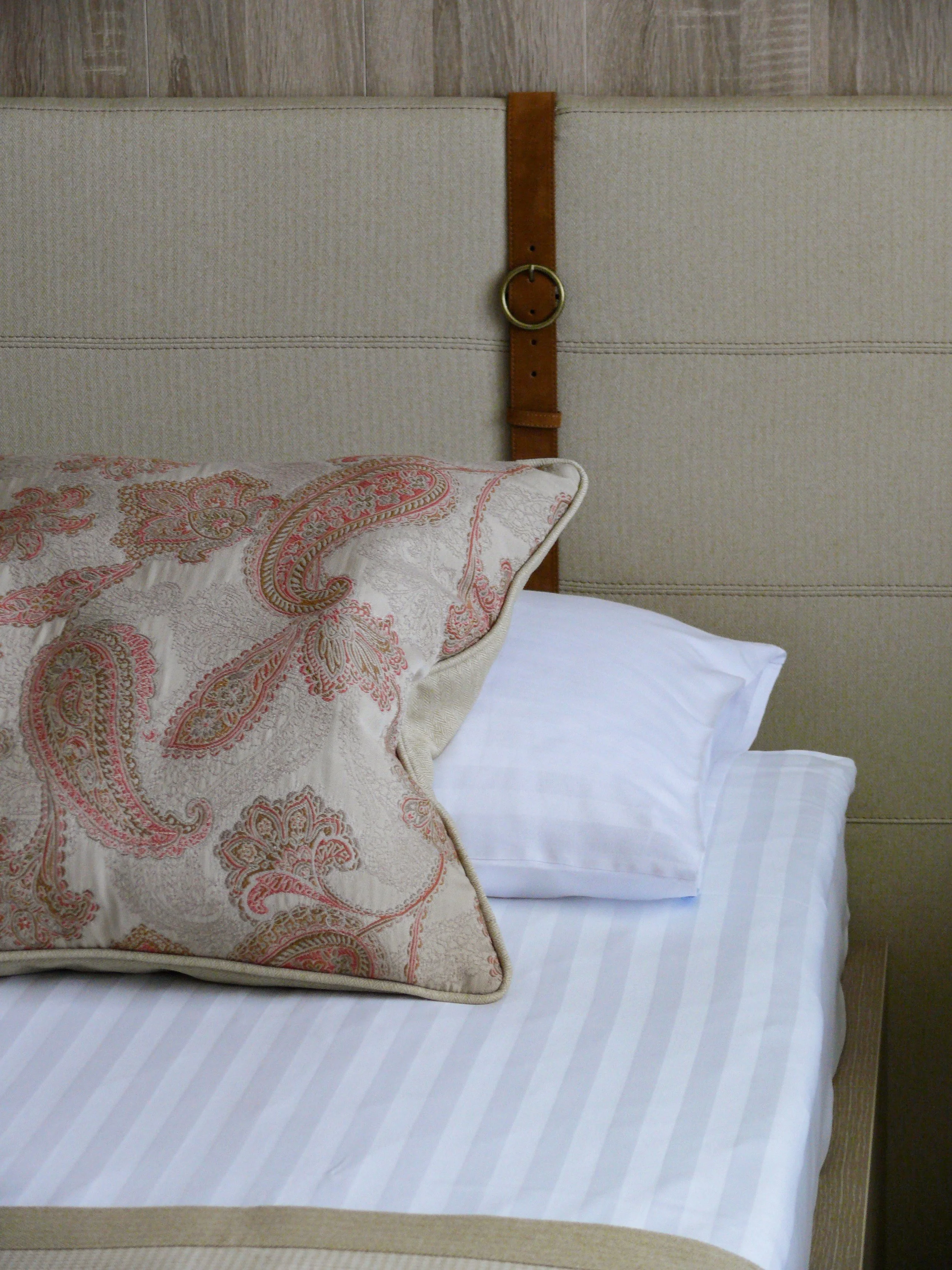 Headboard with leather strap detail, bedroom 2 Hotel Rikli suites Bled Slovenia