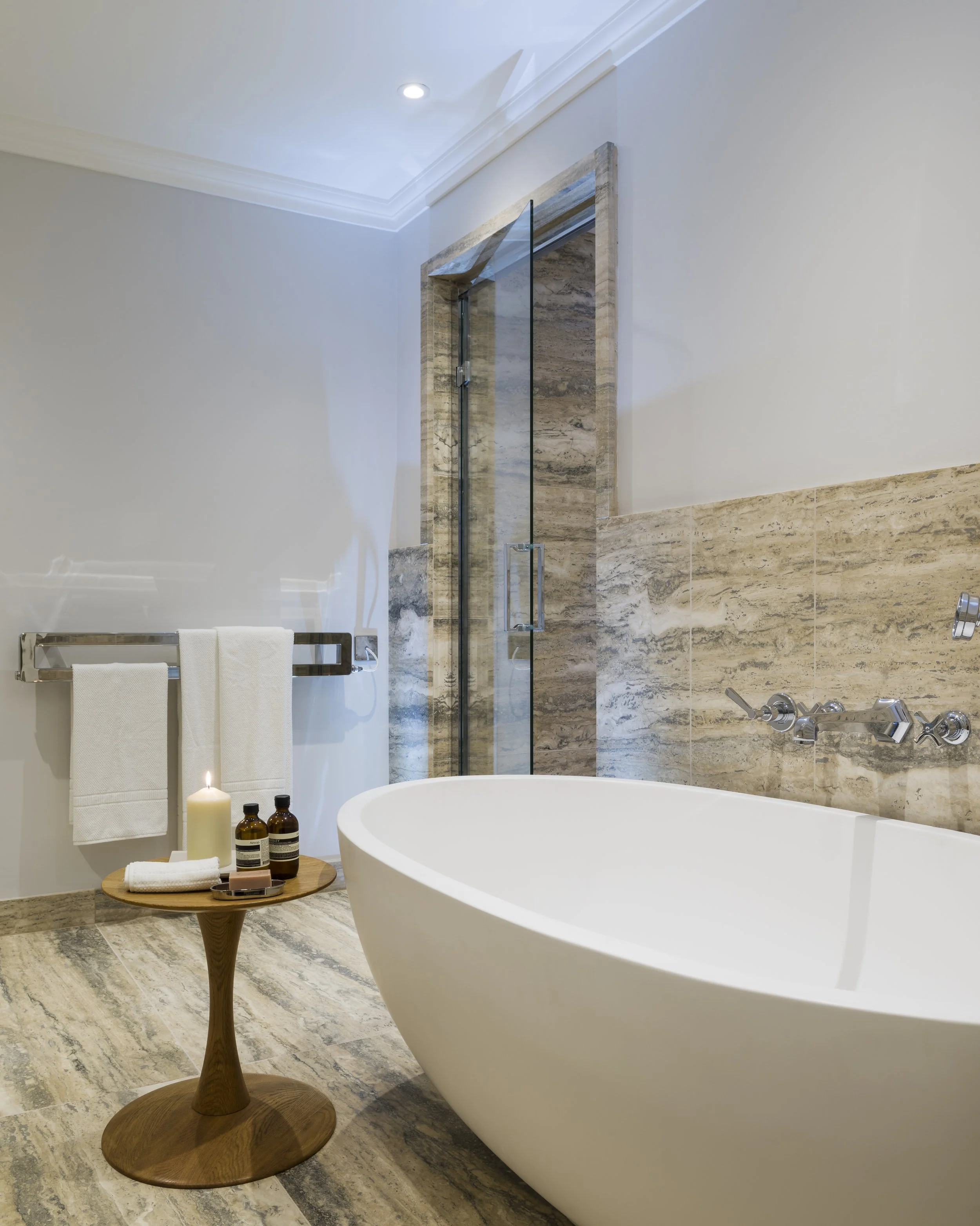 Freestanding oval bath tub travertine bathroom Lennox Gardens Knightsbridge