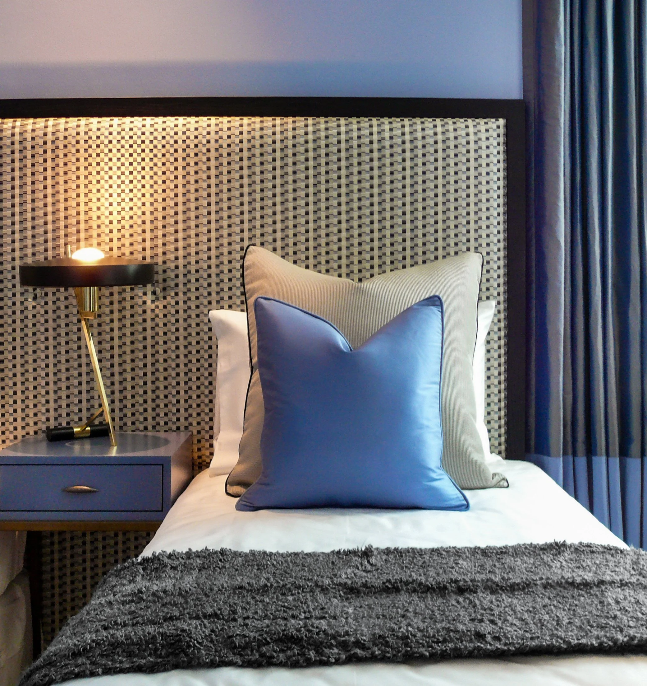 Twin bed and mid century lamp detail, bedroom Orchard apartment Singapore