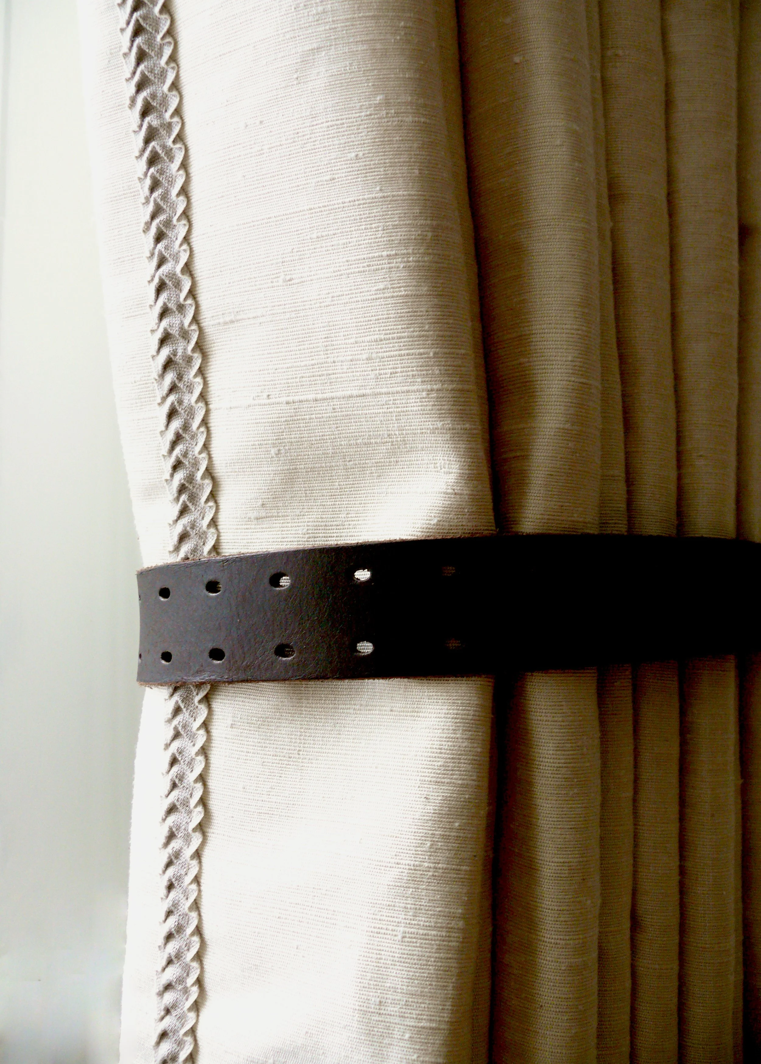 Leather curtain tieback detail, living room Lennox Gardens apartment