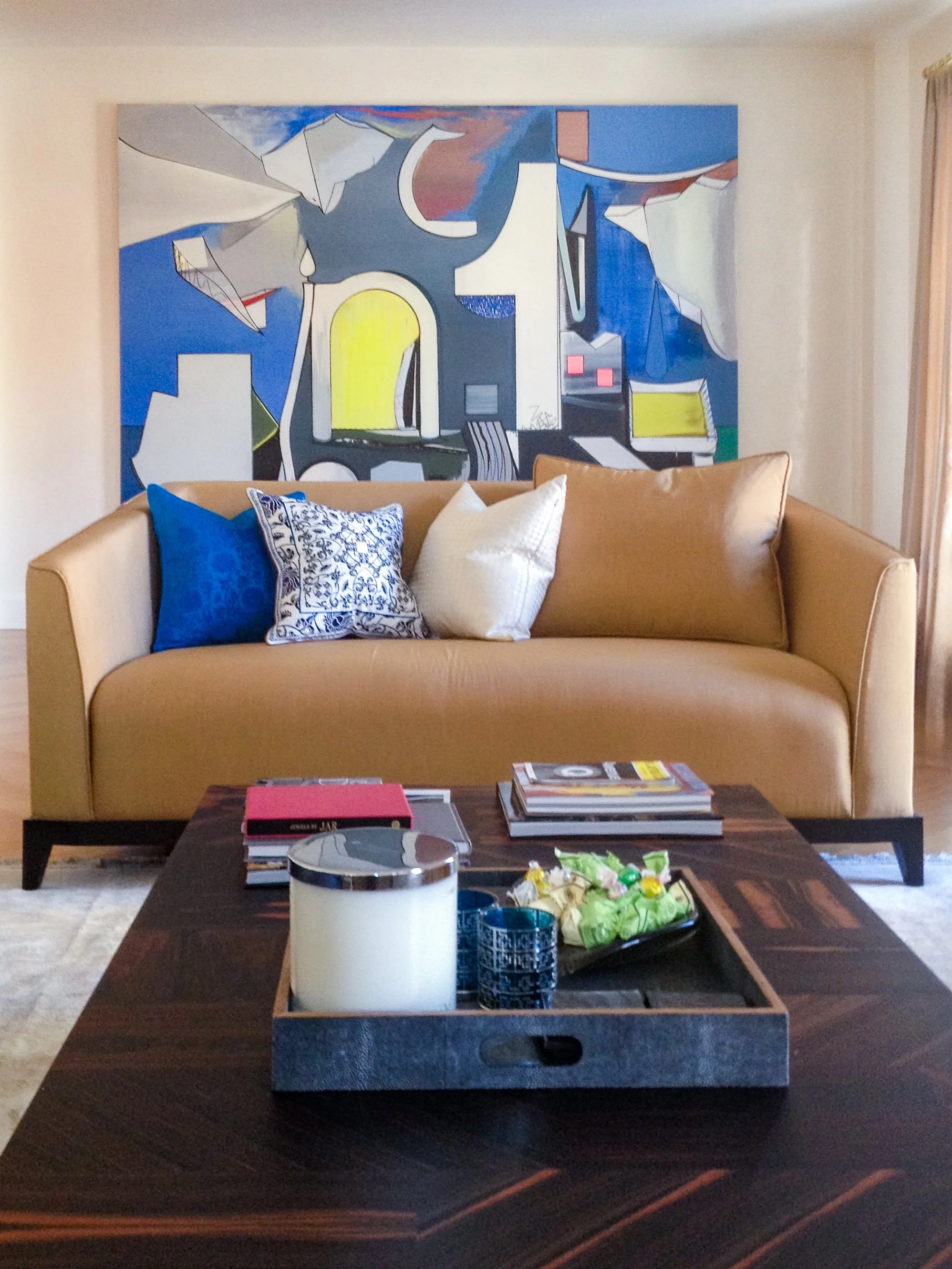 Gold Tondelli sofa with artwork, living room Gramercy Park apartment New York