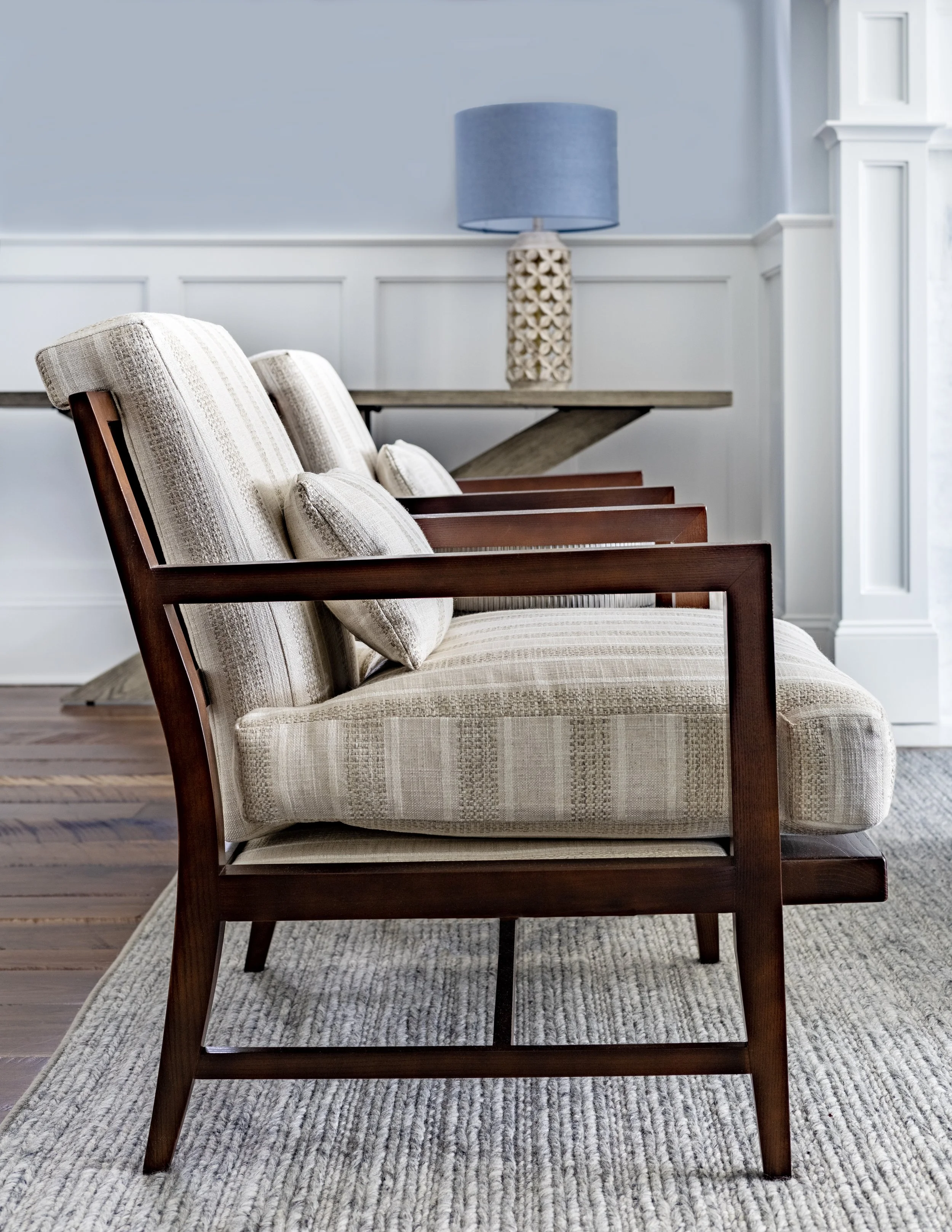 Striped armchair with show wood side detail, coastal living room design Kiawah Island beach house