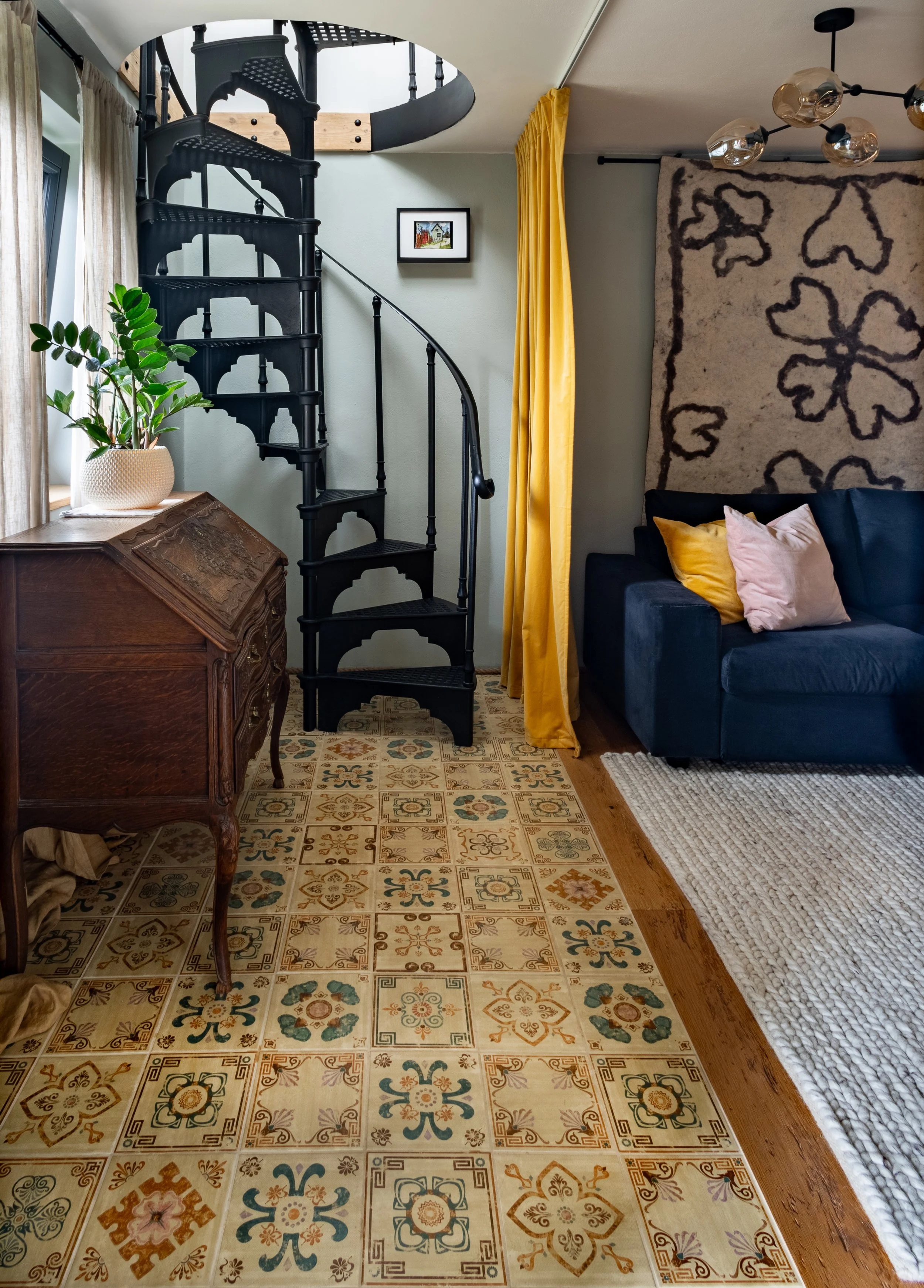 Cast iron staircase and colourful tiles, sitting room vineyard cottage Slovenia