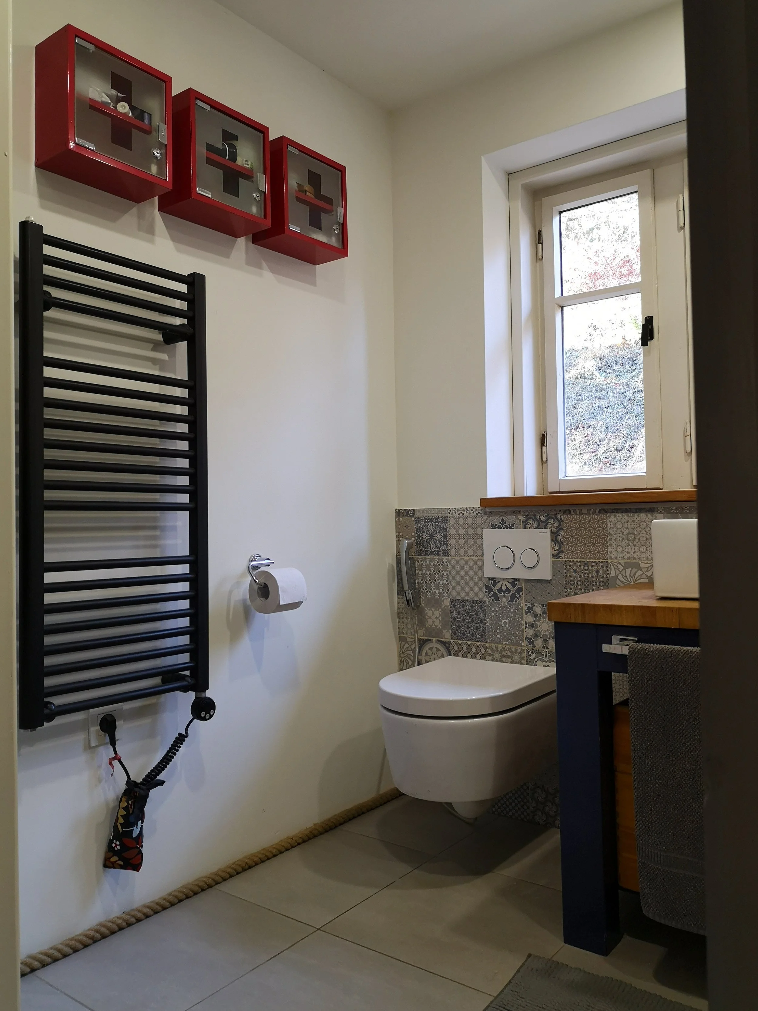 Blue patchwork bathroom cabinet detail Pokljuka Slovenia