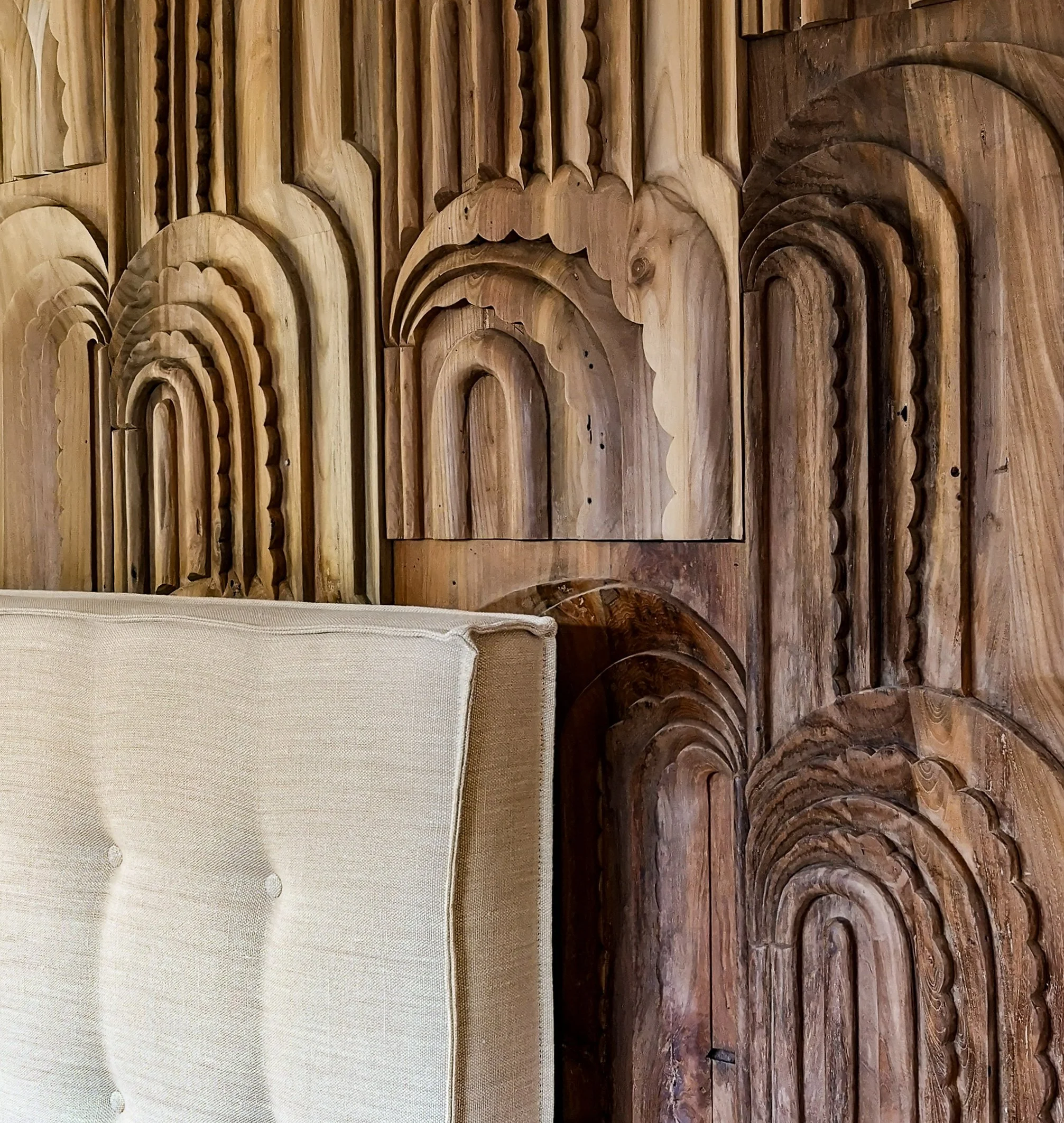 Wonderwall panels and linen headboard in luxury bedroom interior