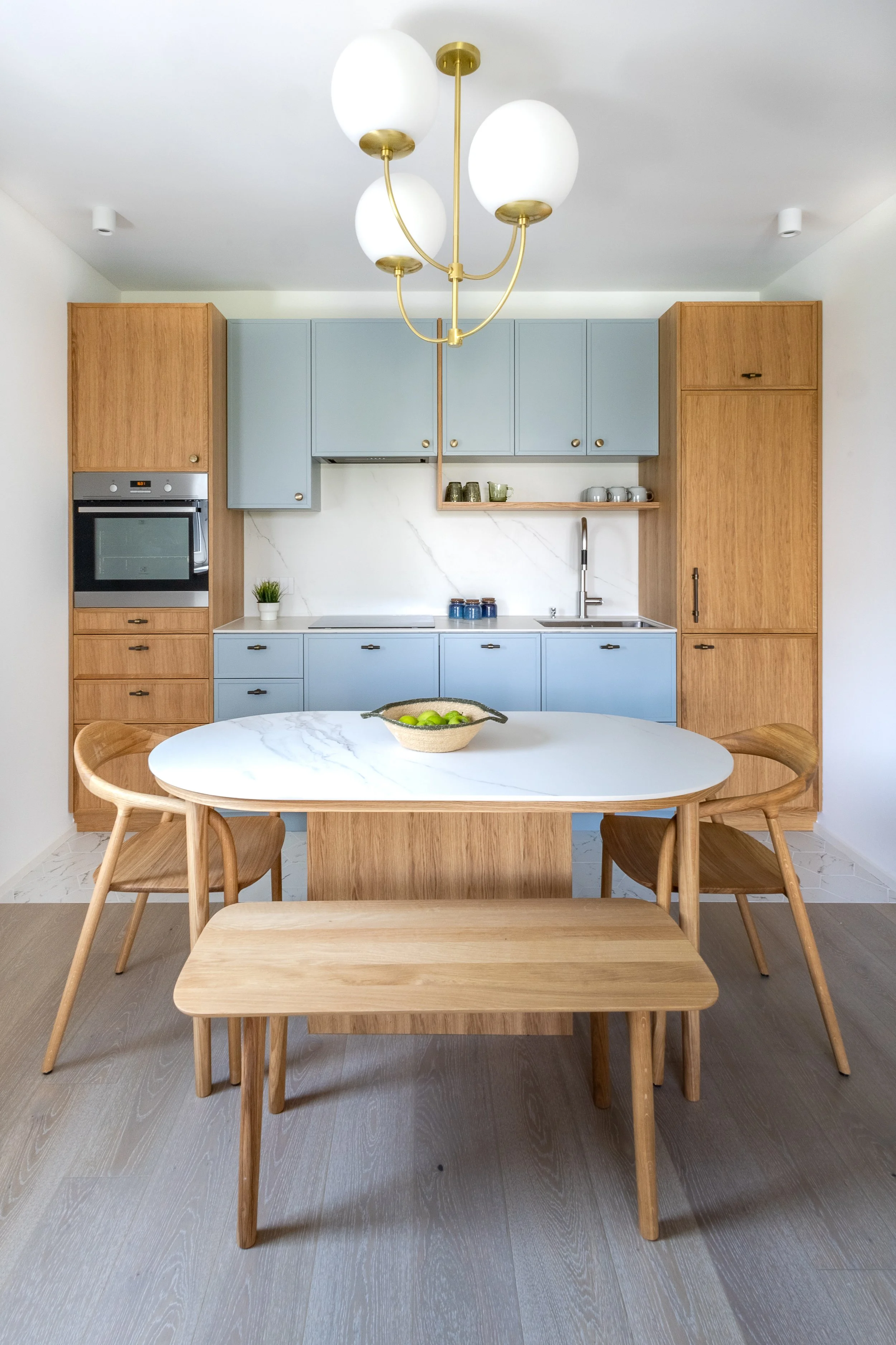 Natural oak and baby blue kitchen units, kitchen Ljubljana Bezigrad apartment