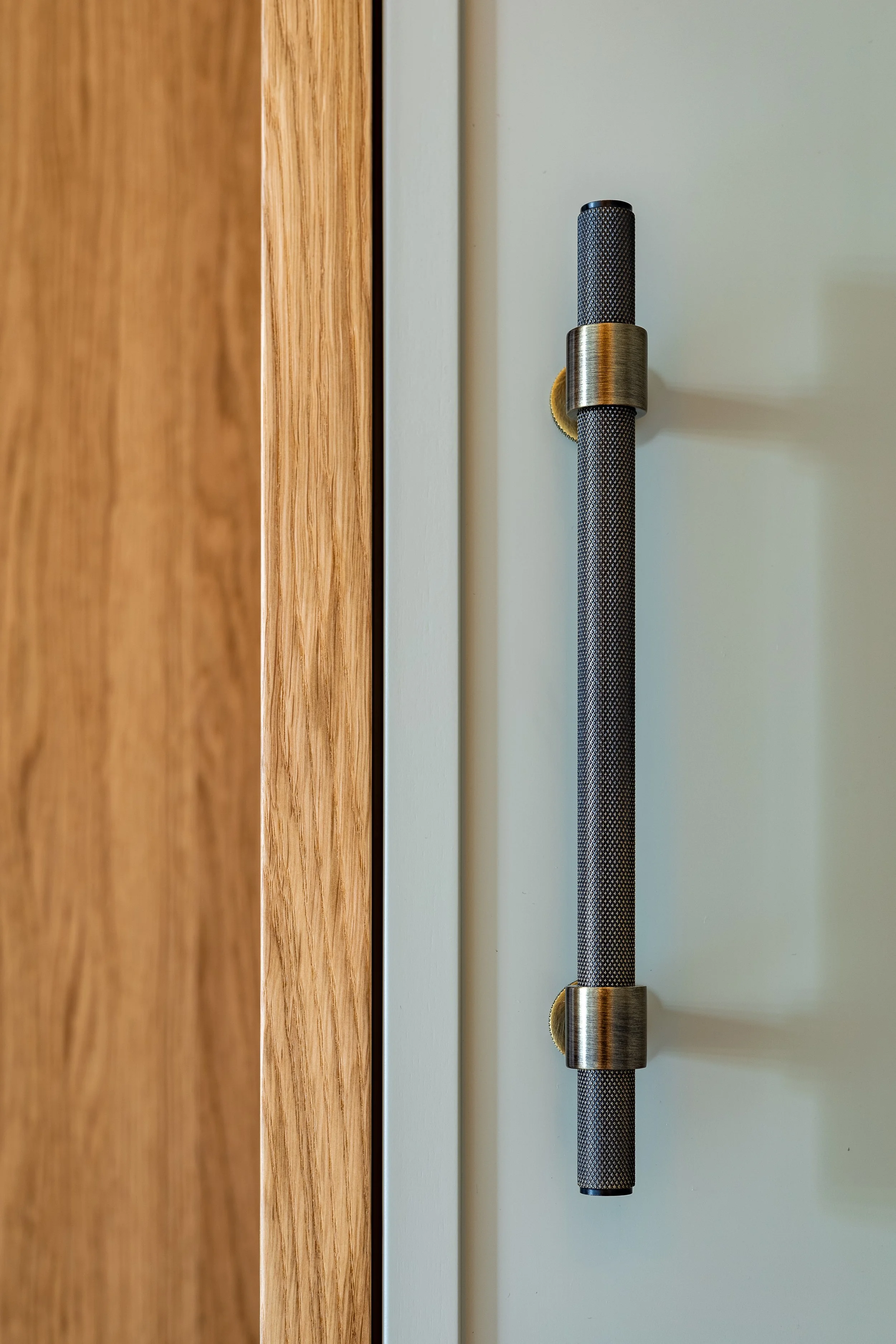 Bespoke joinery and brass handle detail, entrance hallway Ljubljana Bezigrad apartment