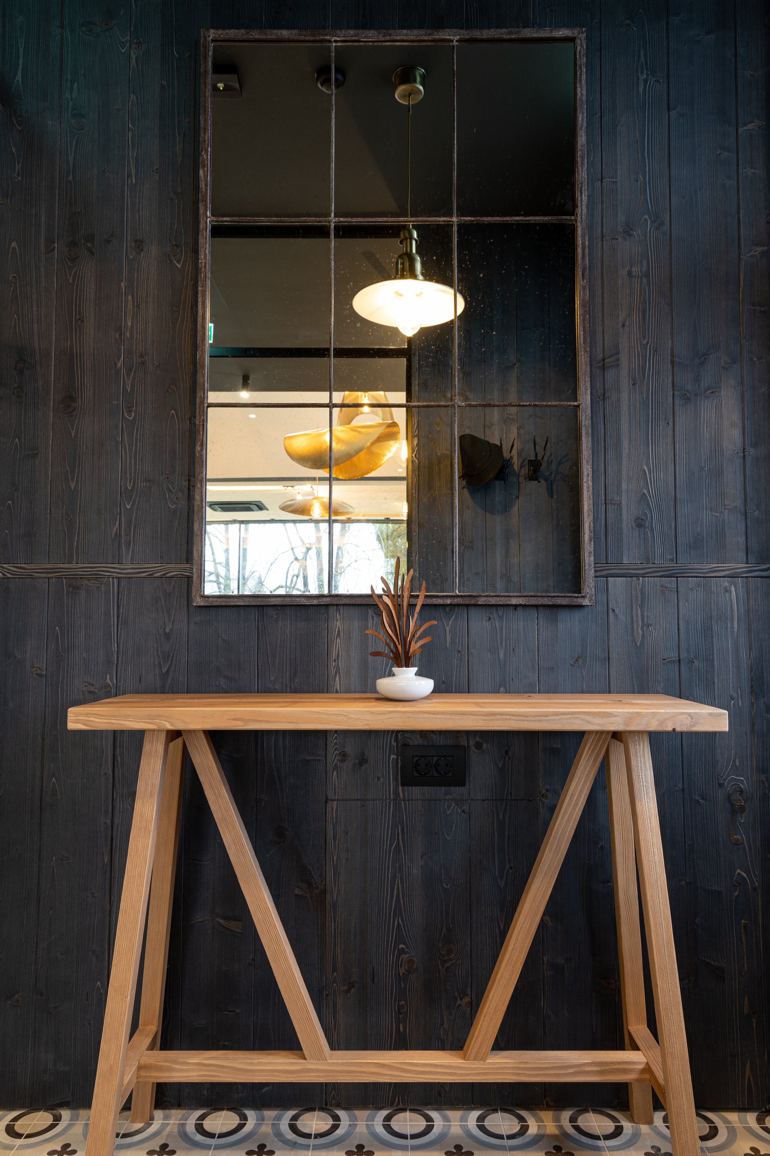 Entrance console table and antiqued mirror detail Sunrose 7 boutique hotel Slovenia
