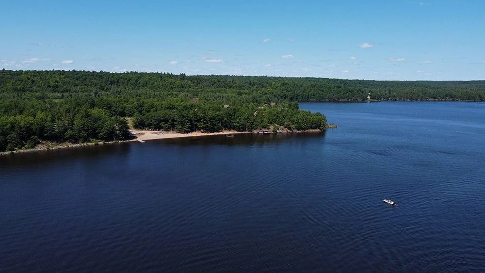 An aerial view of the lake at Whitewater Cottage & RV Resort