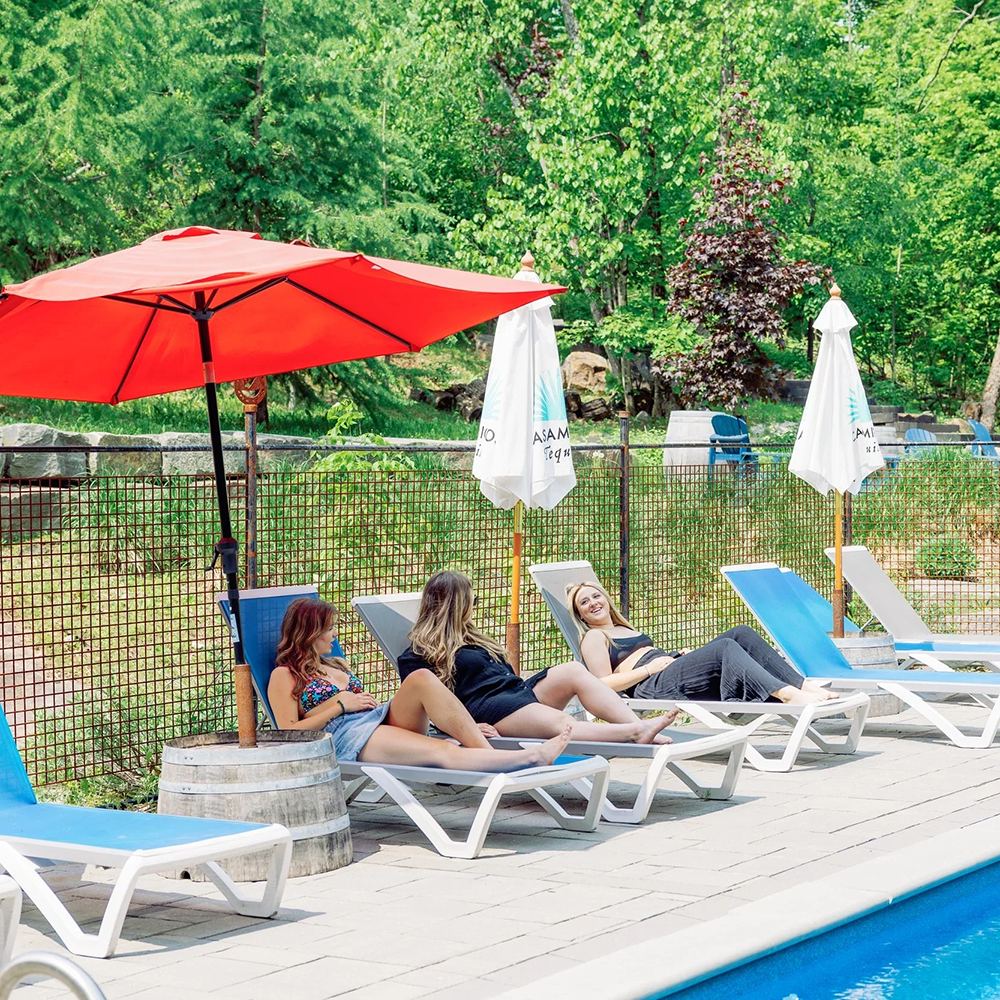 an image of girls lounging by the pool