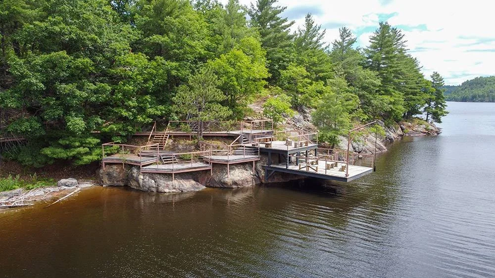 An image of an intricate deck setup at Whitewater Cottage & RV Resort