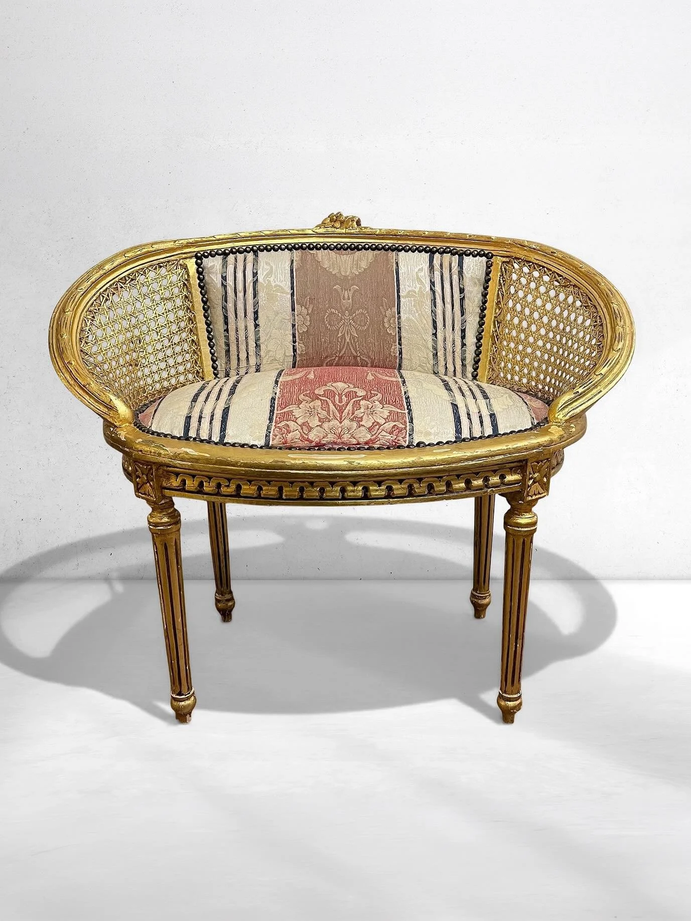 Petite Louis XVI-Style Cane Settee, Original Tapestry Upholstery | Giltwood Accent Bench 

~~~~~~~~~~~~~~~~~~~~~~~~~

A refined statement in scale and craftsmanship, this petite Louis XVI&ndash;style settee embodies the quiet elegance of European sal
