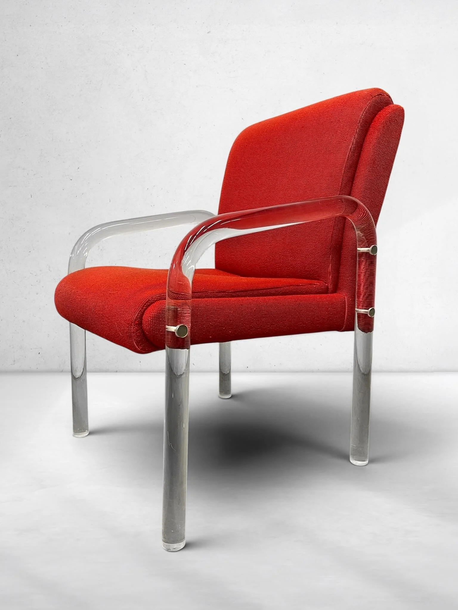 1970s Lucite &amp; Chrome Lounge Chair Attributed to Leon Frost for Lion in Frost 

~~~~~~~~~~~~~~~~~~~~~~~~~

A striking 1970s lucite and chrome lounge chair with vivid red upholstered cushions and a sculptural Art Deco revival silhouette. The chair