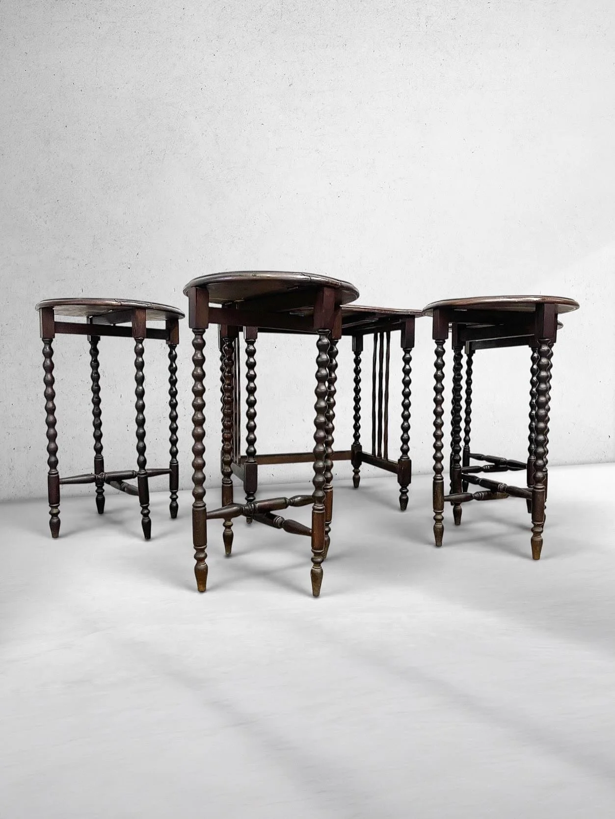 Antique c. 1920s Jacobean Revival Bobbin Nesting Table Suite with Four Folding Side Tables

~~~~~~~~~~~~~~~~~~~~~~~~~

A rare antique circa 1920s Jacobean Revival bobbin nesting table suite, featuring a larger host table with four individual folding 