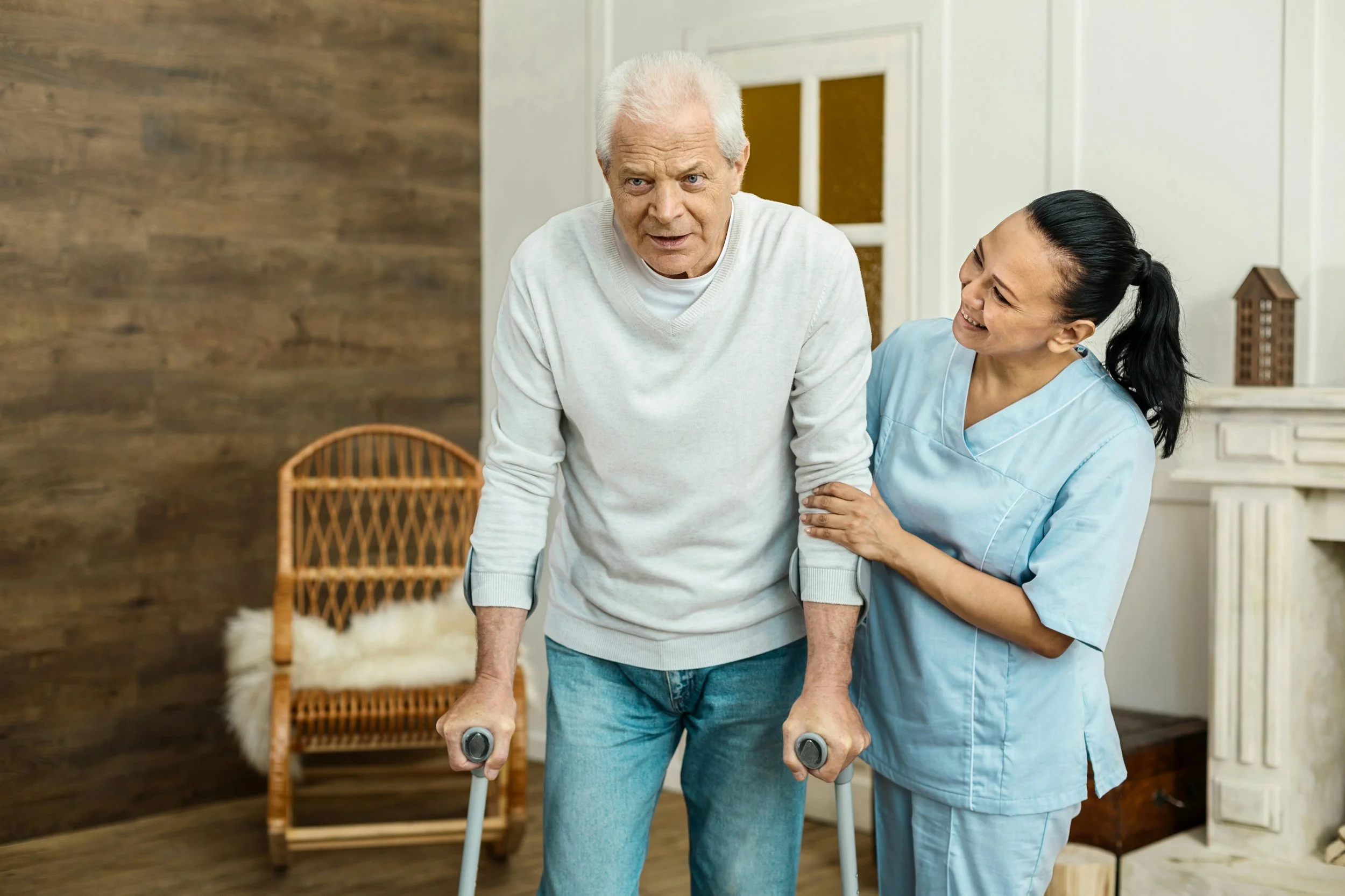A home health nurse assisting a patient.