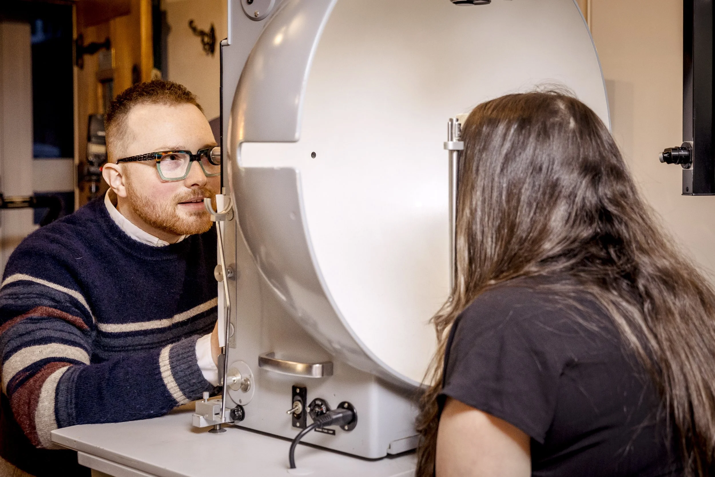 Prof. Christian French performing an assessment for post-concussion vision problems.