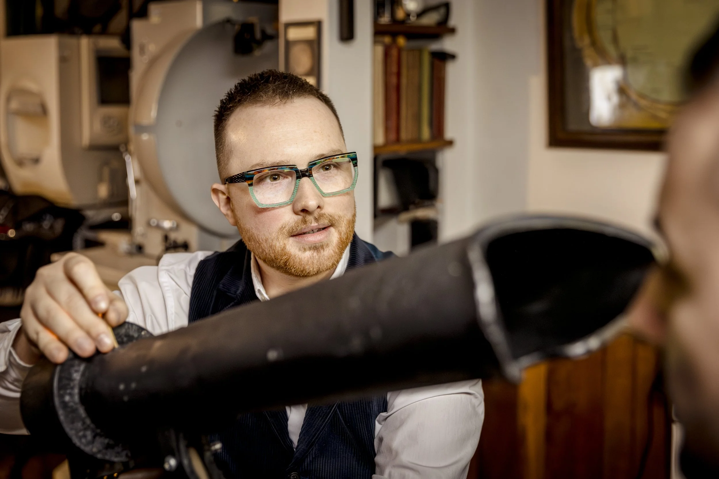 A patient receiving syntonic phototherapy as part of a neuro-optometry consultation to treat visual processing issues.
