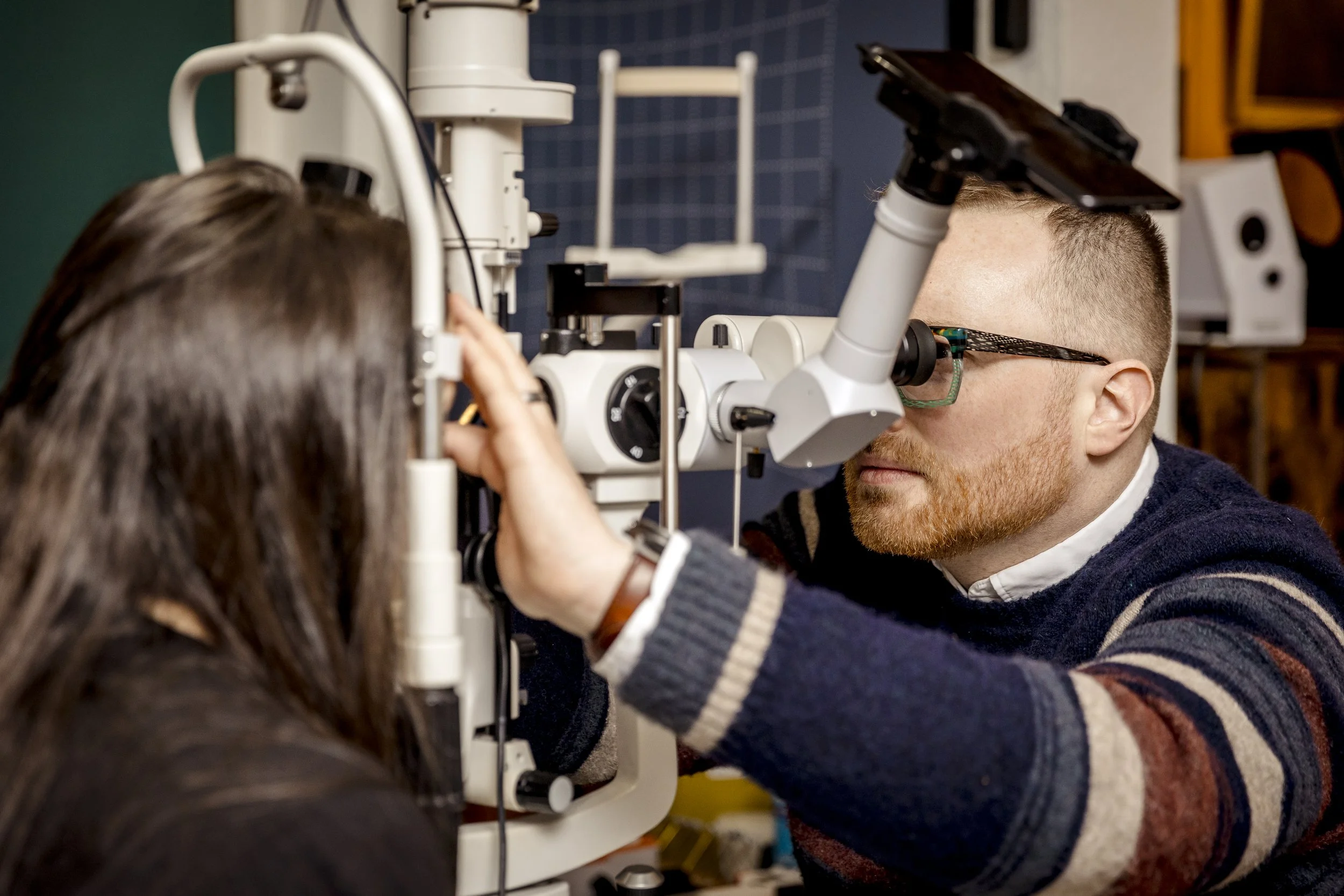 Prof. Christian French - Consulting Neuro-Optometrist performing a comprehensive clinical eye examination.