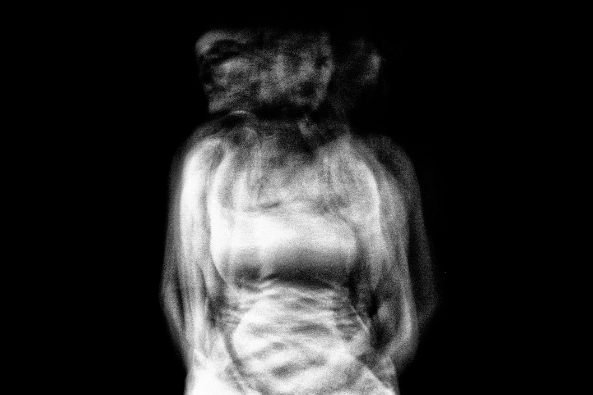 blurred image of woman giving her 3 heads