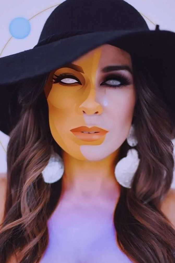 A woman wearing a large black hat with saturn rings and flowing brown hair. Her face is partially covered with digital art effects that create a stylized, half-real, half-cartoon appearance, with eyes white like crows