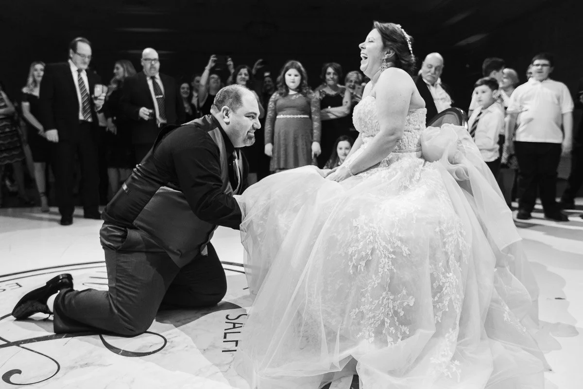 Wife laughing at her groom for falling for her prank at ascot parc event center