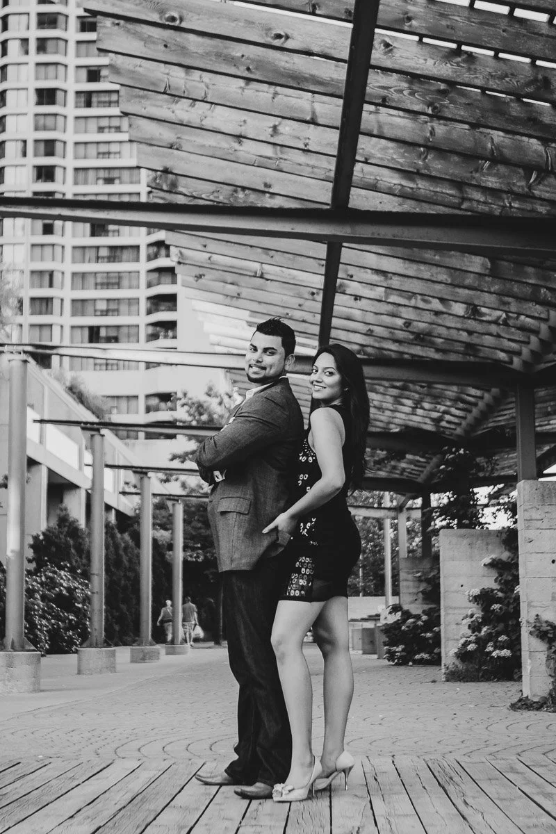 Beautiful wall worthy black and white portrait of couple elegantly dressed at Harbour front Toronto