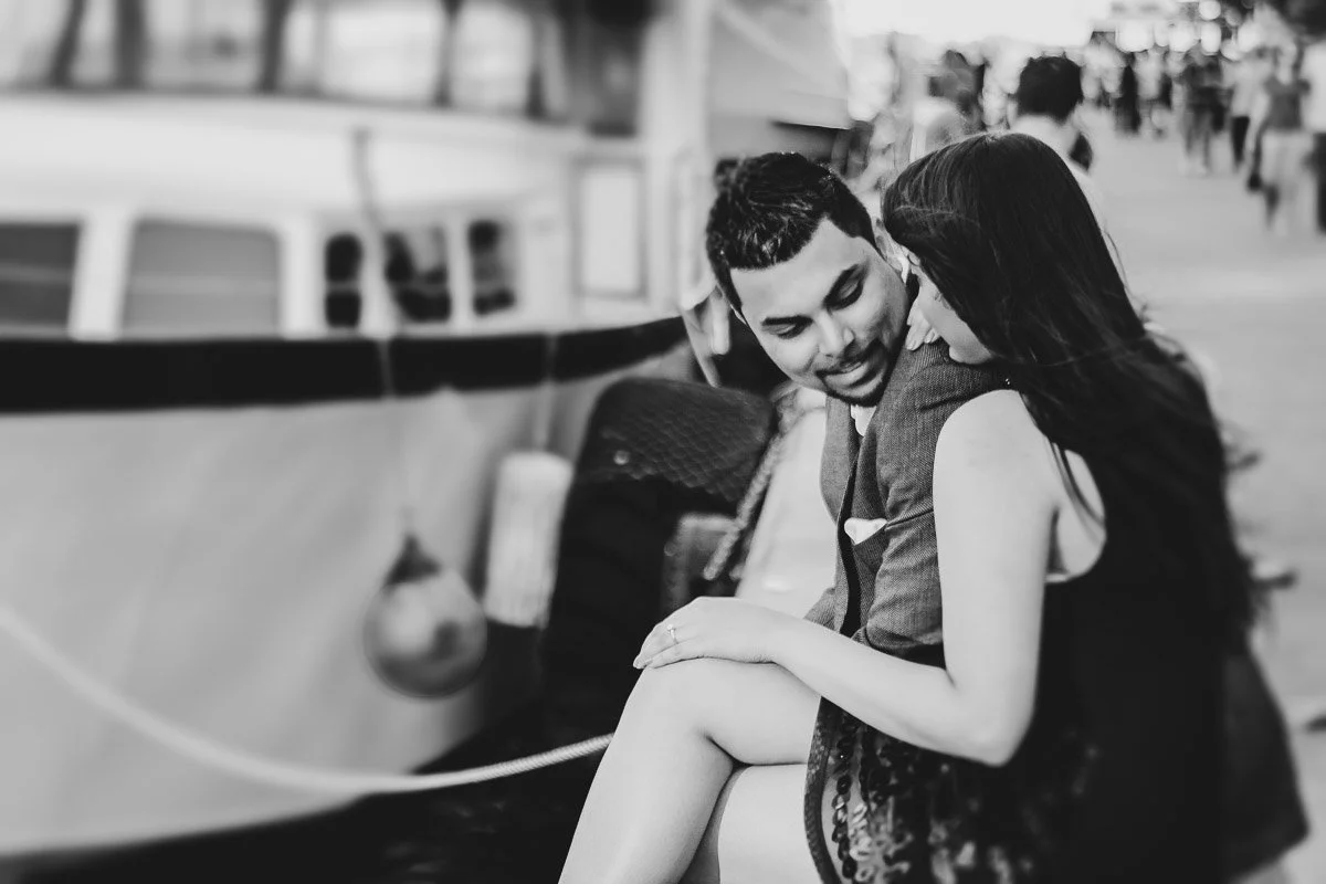 Black and white portrait of a couple having a sweet moment at Toronto harbour front