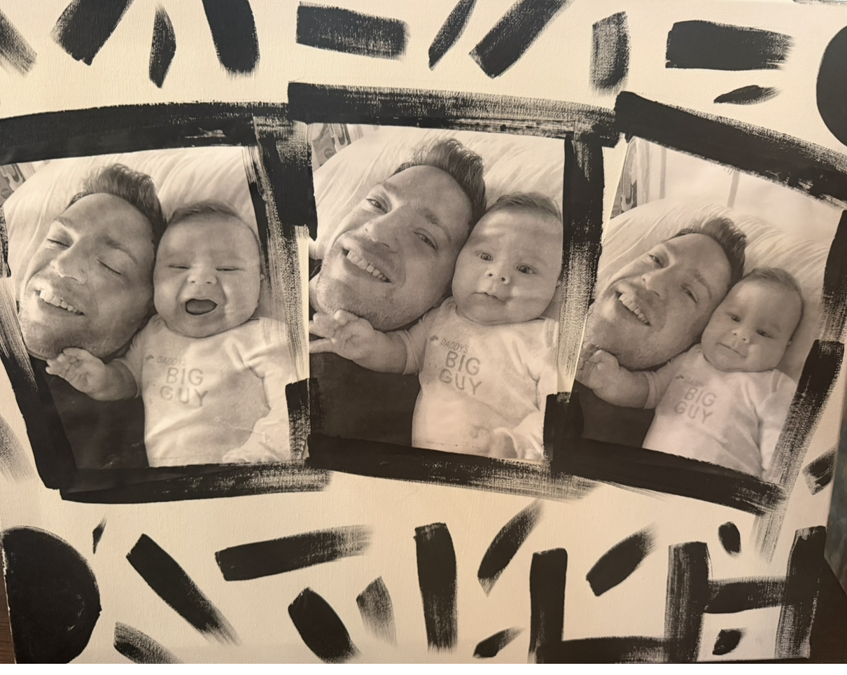 Black and white photo collage of a man and a baby lying together, with the man smiling and the baby showing different expressions, framed by artistic black paint strokes.