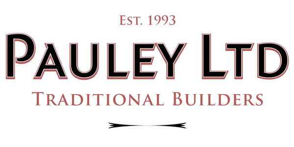 Logo for Pauley Ltd, a traditional builders company established in 1993, with red and white text on a black background.