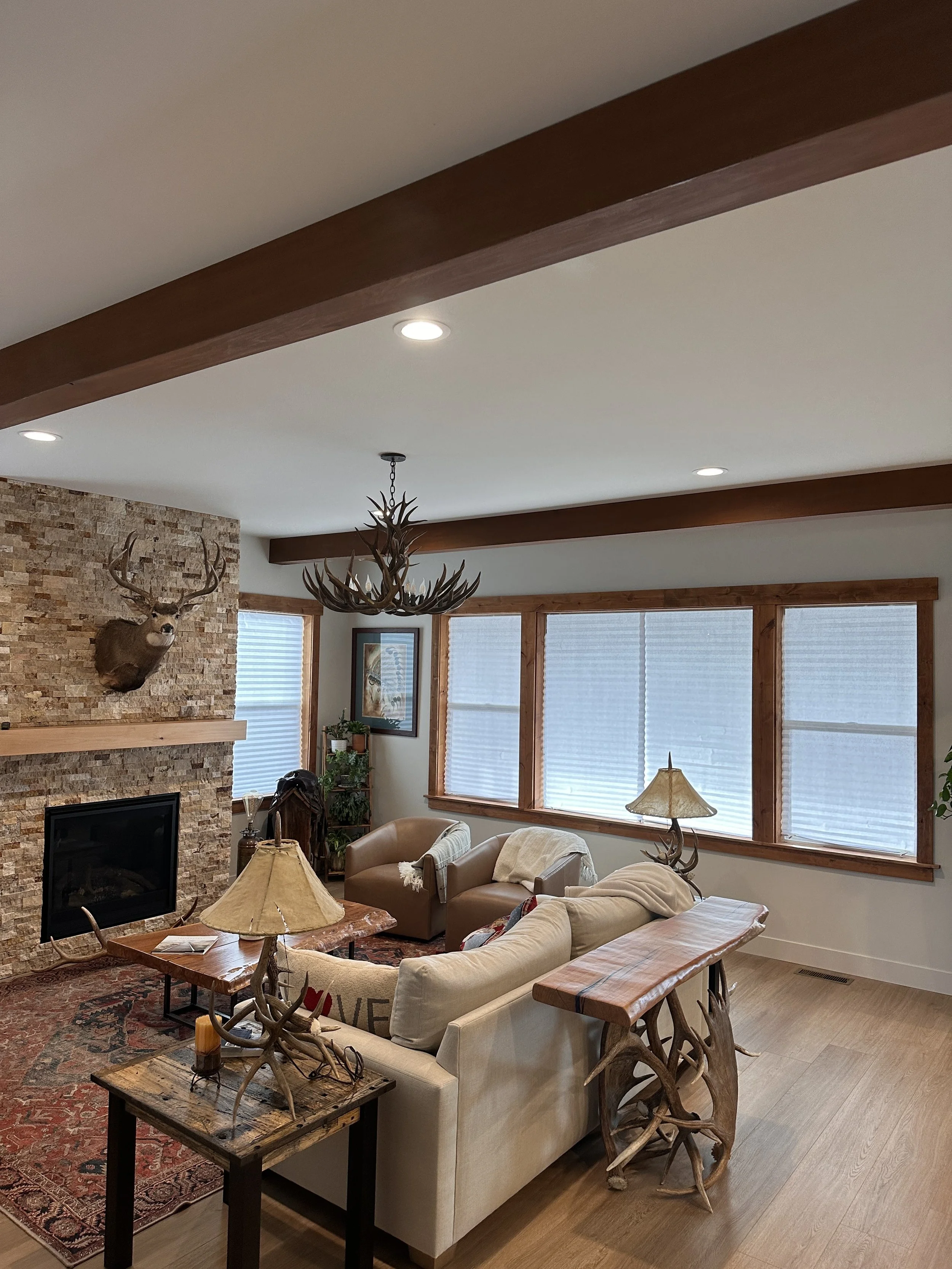 Faux beams, jamb and case windows, tile fireplace, mantel