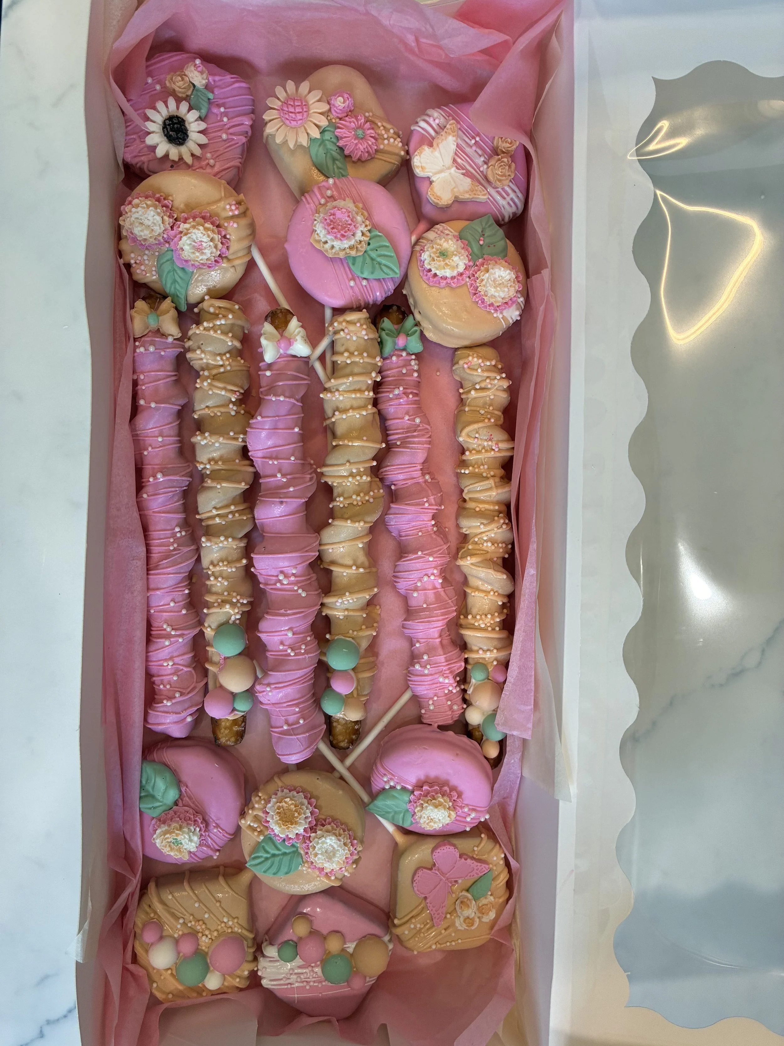 1 dozen cake pops, 6 pretzels w/ caramel