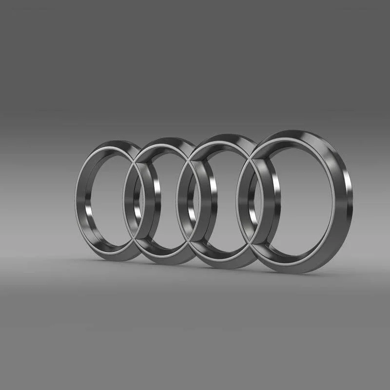 Four metal rings arranged in a row on a gray background, with the rings overlapping each other.