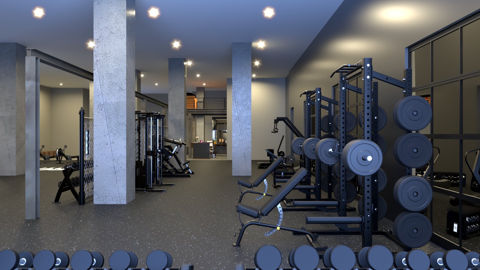Modern gym with weightlifting equipment, exercise machines, and free weights, illuminated by overhead lights, featuring concrete pillars and a speckled rubber floor.