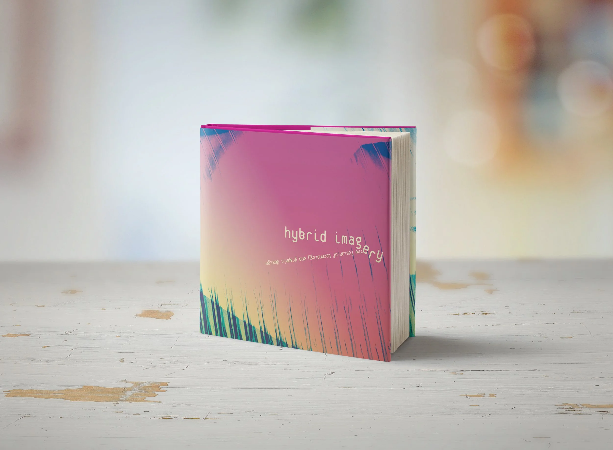 The finished cover with the pink side facing up. The dust jacket has a little fun with the typography, knocking letters around and combining both digital and traditional mediums.