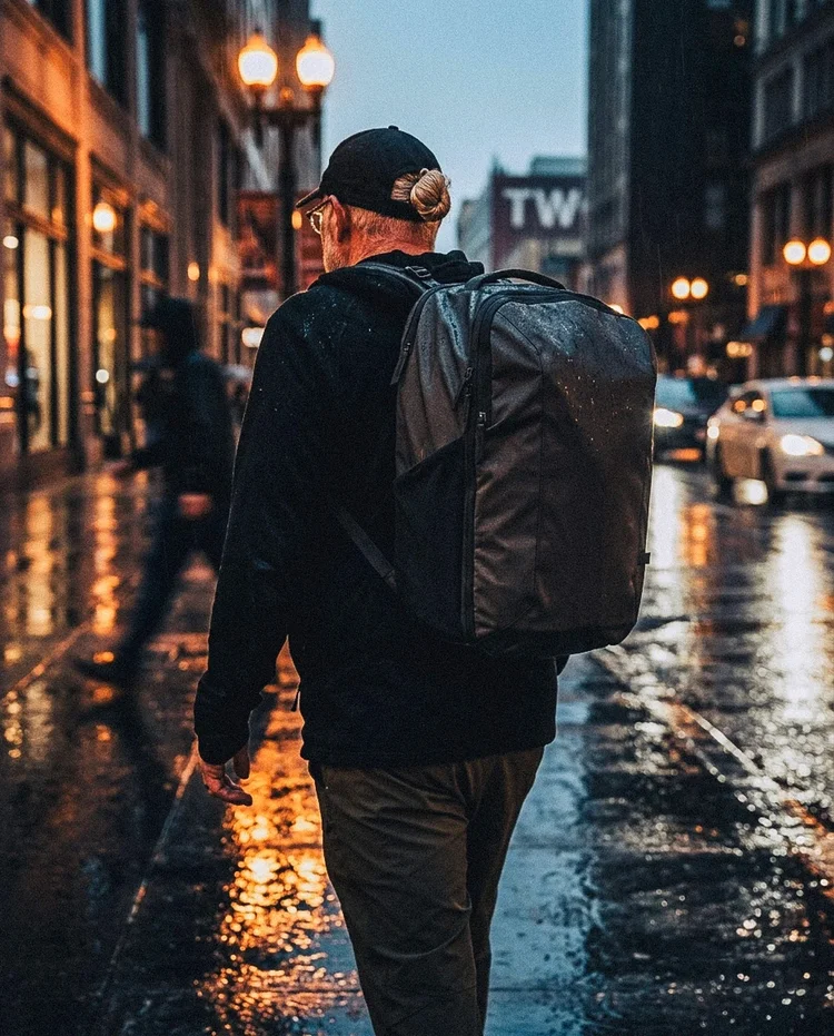 RC wearing a loaded backpack, portrait shot with warm shadows