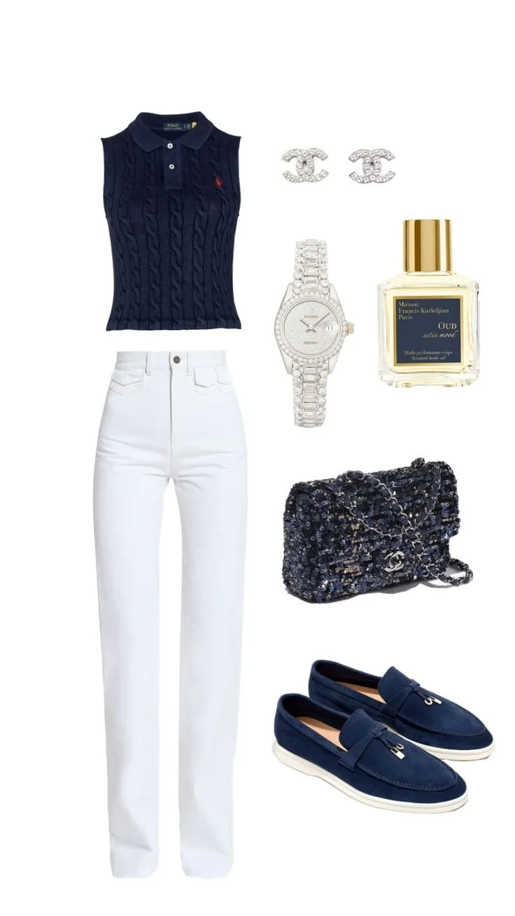 A navy sleeveless cable-knit polo shirt paired with white high-waisted jeans, accessorized with Chanel earrings, a silver wristwatch, a black and silver Chanel bag, blue loafers, and a bottle of Maison Francis Kurkdjian Oud perfume.