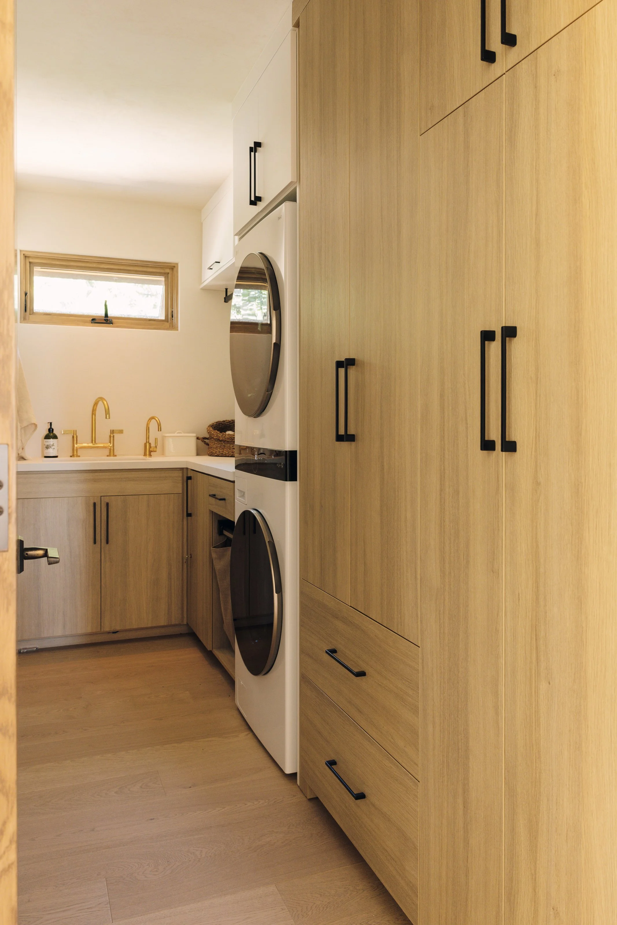 Full laundry room with stacked washer and dryer