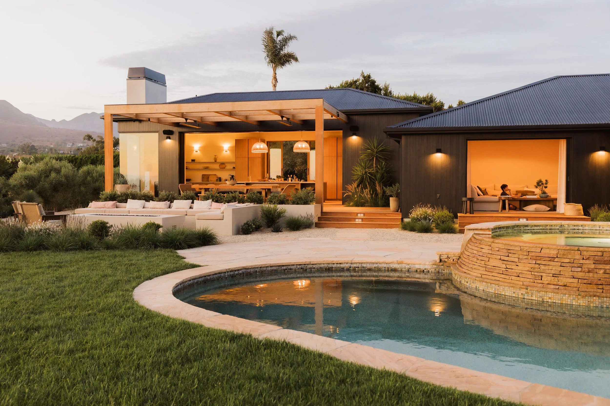 Pool and rear exterior at dusk