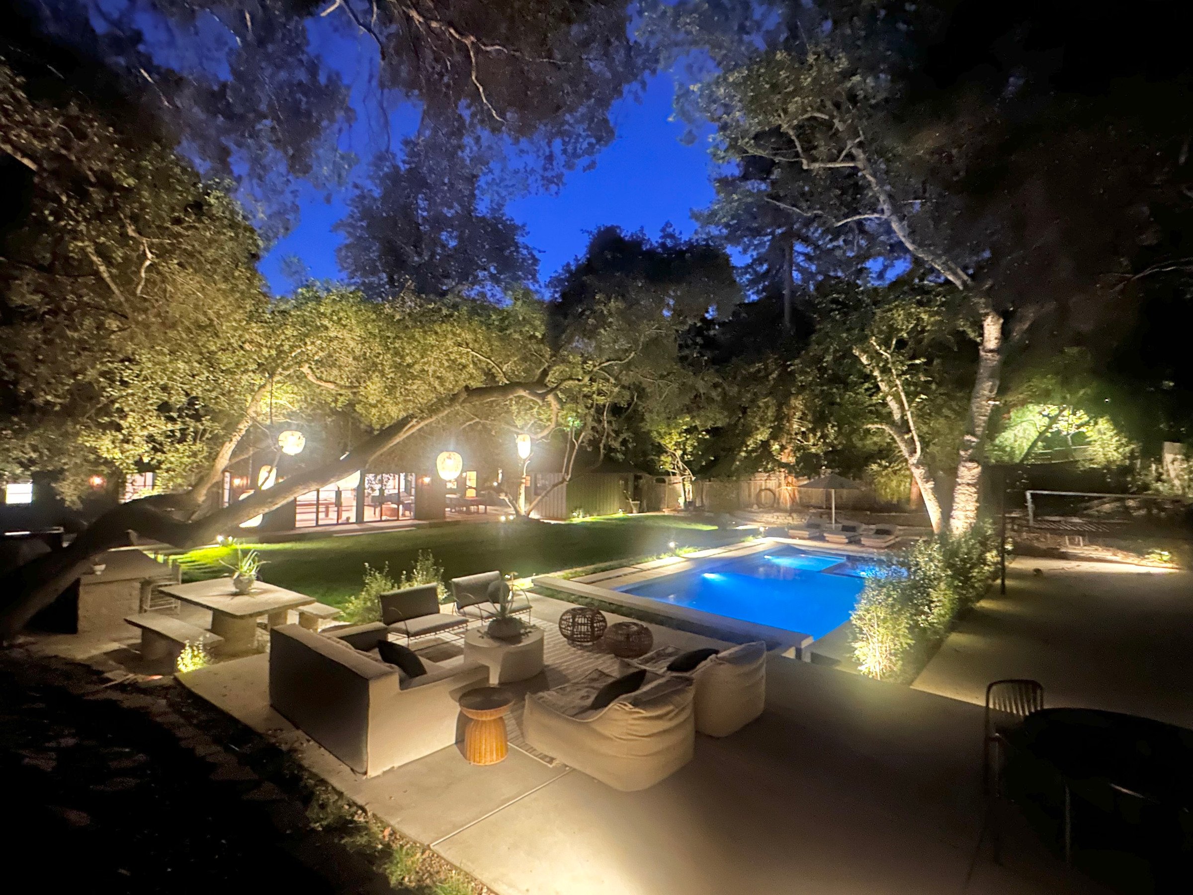 Rear garden, pool and lounge at dusk. | PL-3803