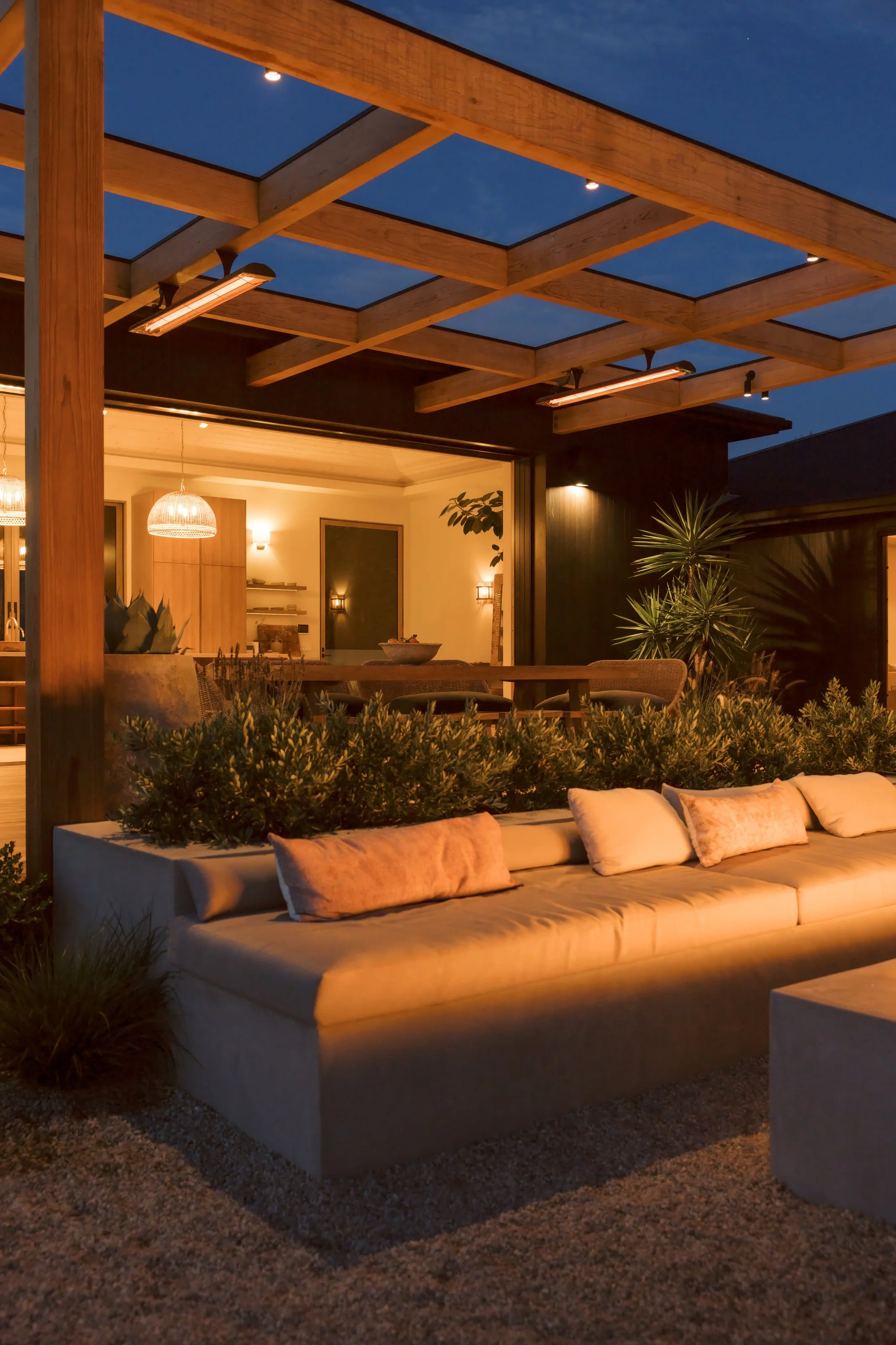 Outdoor lounge and illuminated covered terrace