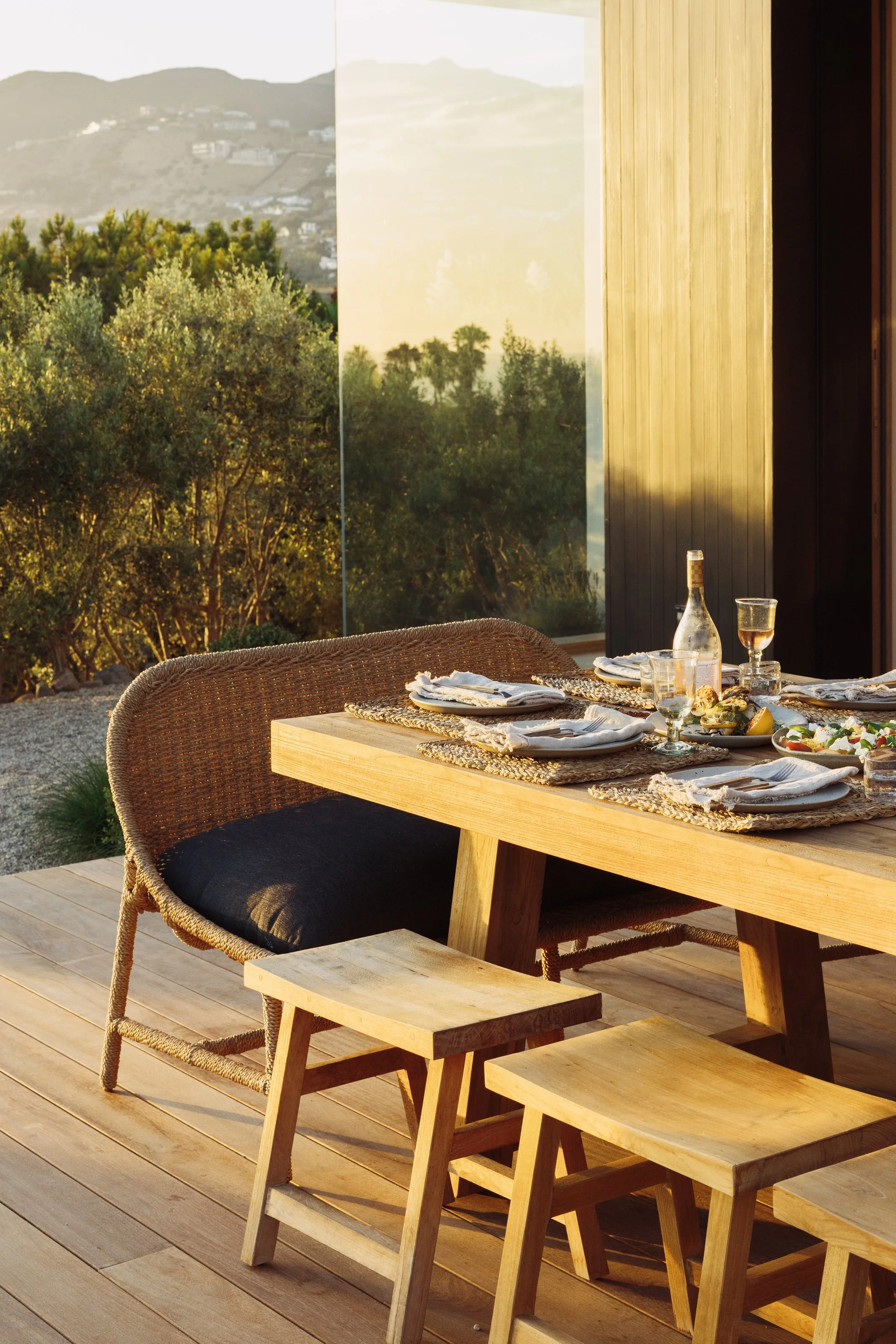 Dining table with garden and hillside views