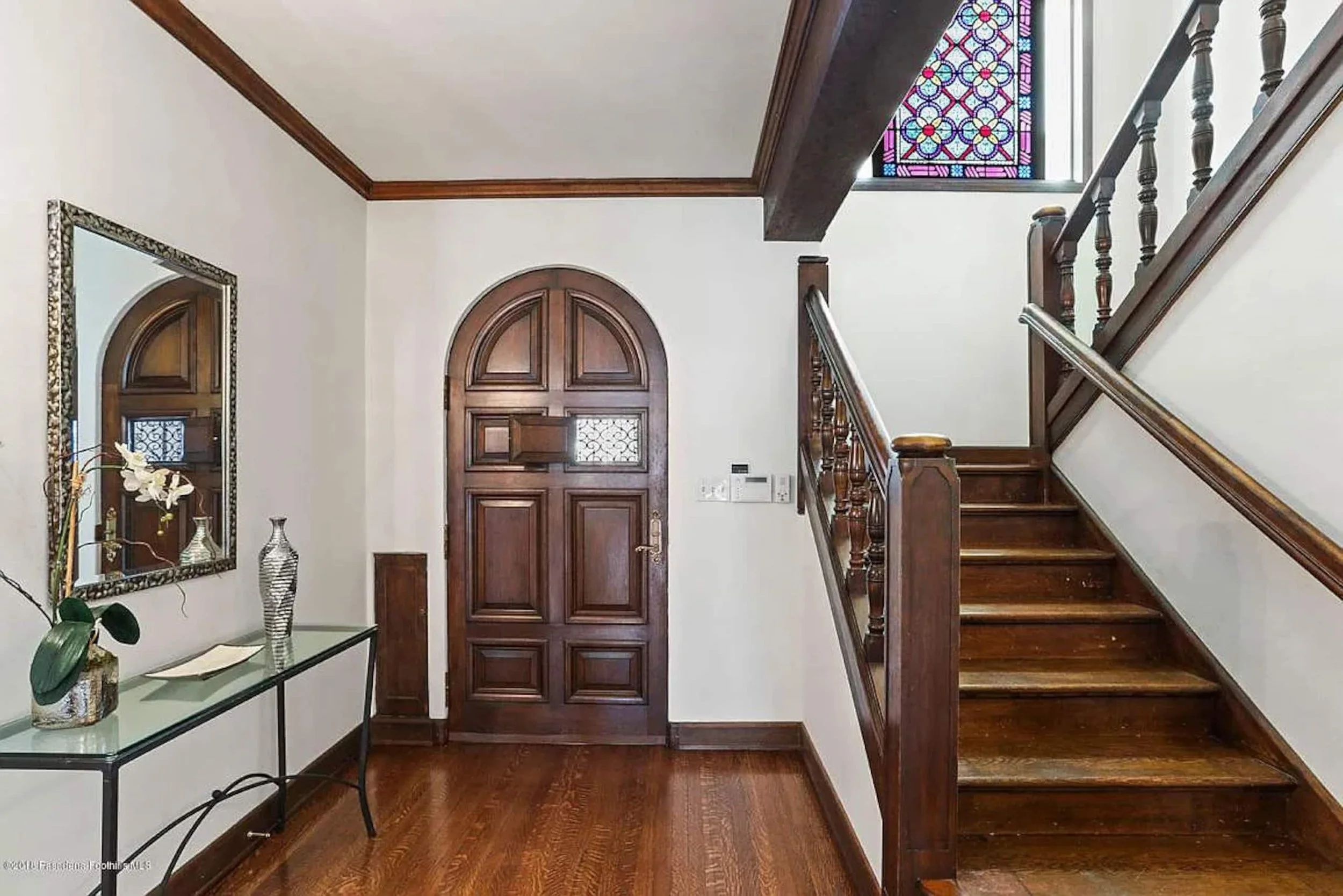 PL4102-010-wood-staircase-and-arched-front-door.jpg