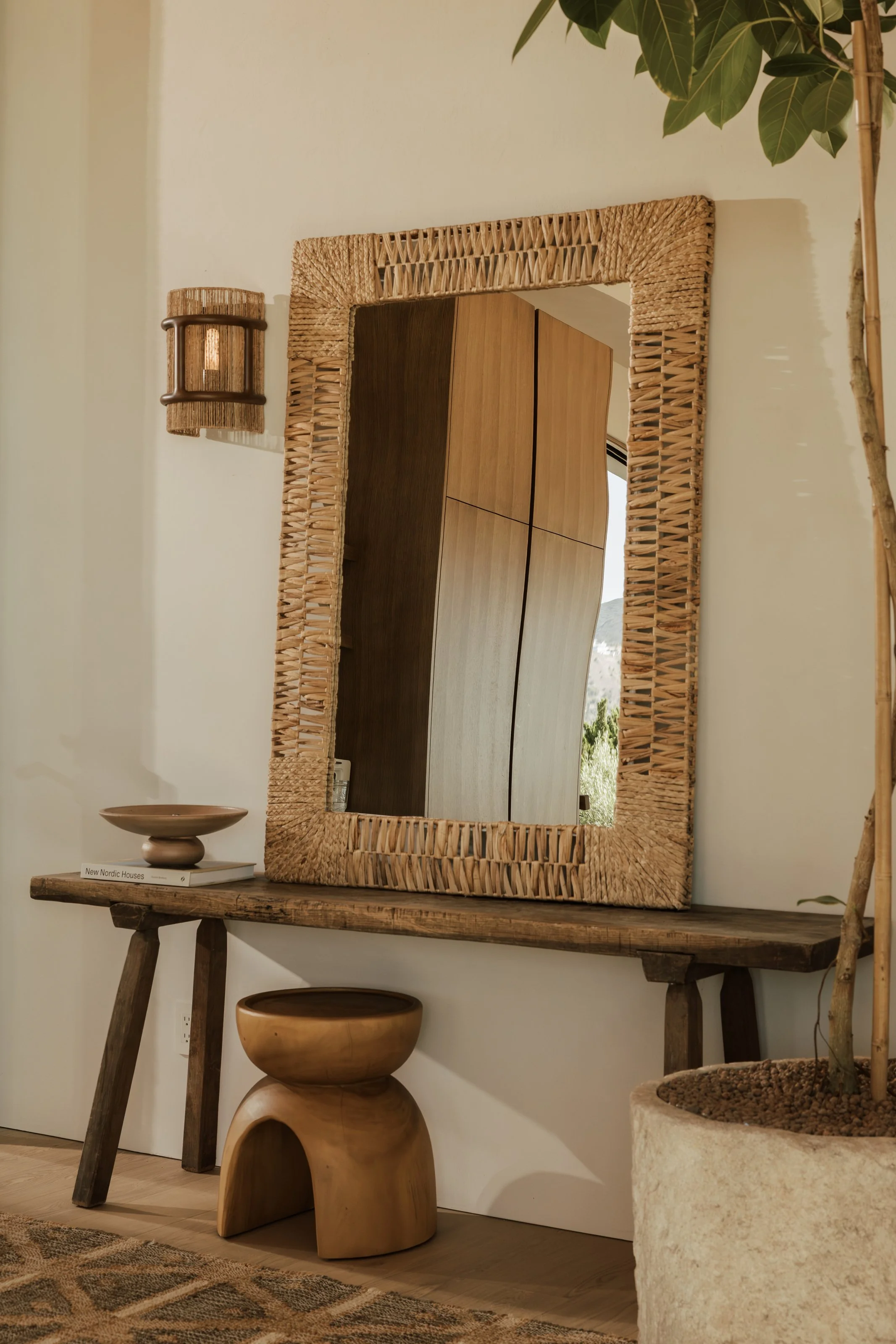 Entry bench and carved wood mirror