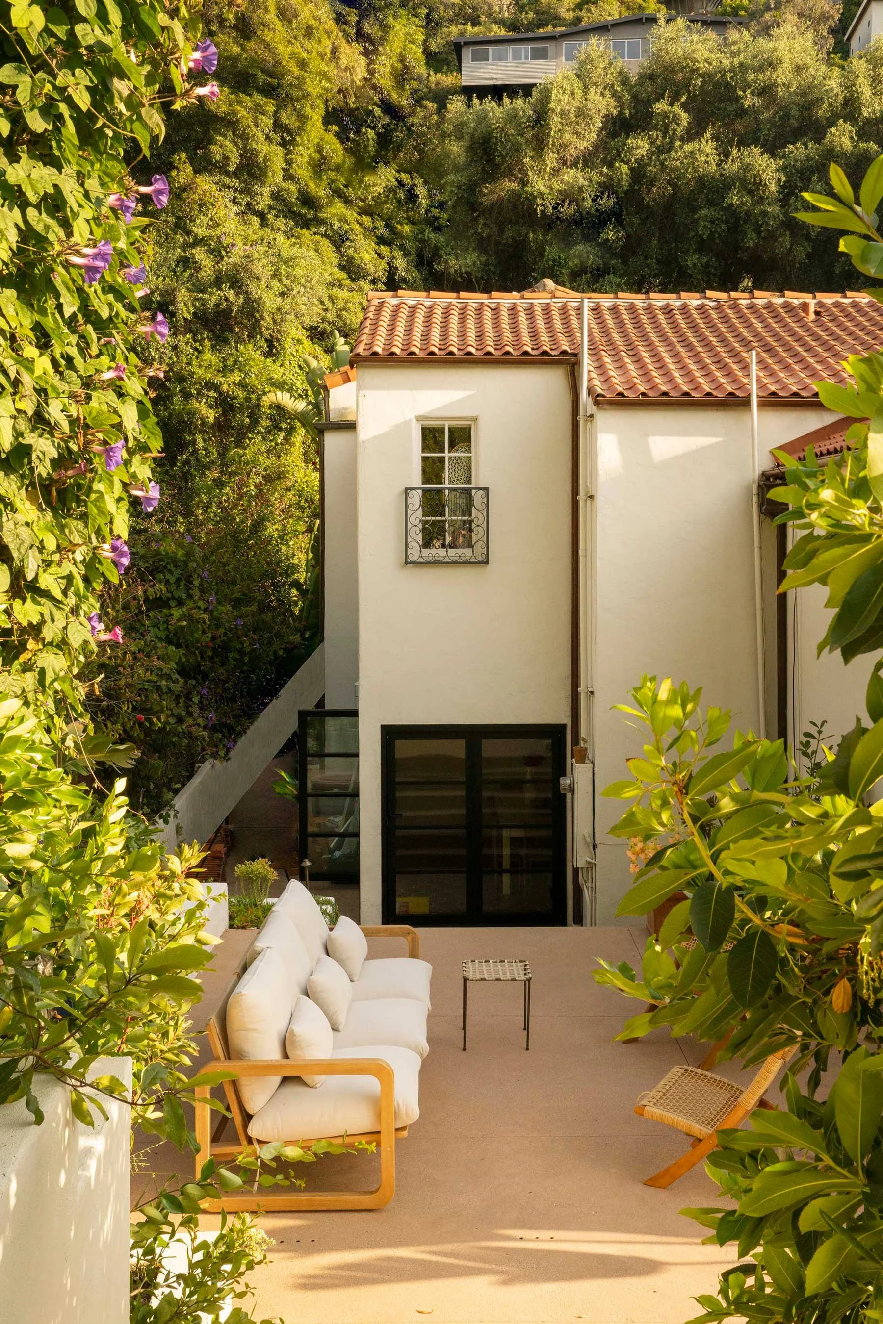 PL6014-033-patio-terracotta-roof-white-sofa-black-french-doors.jpg
