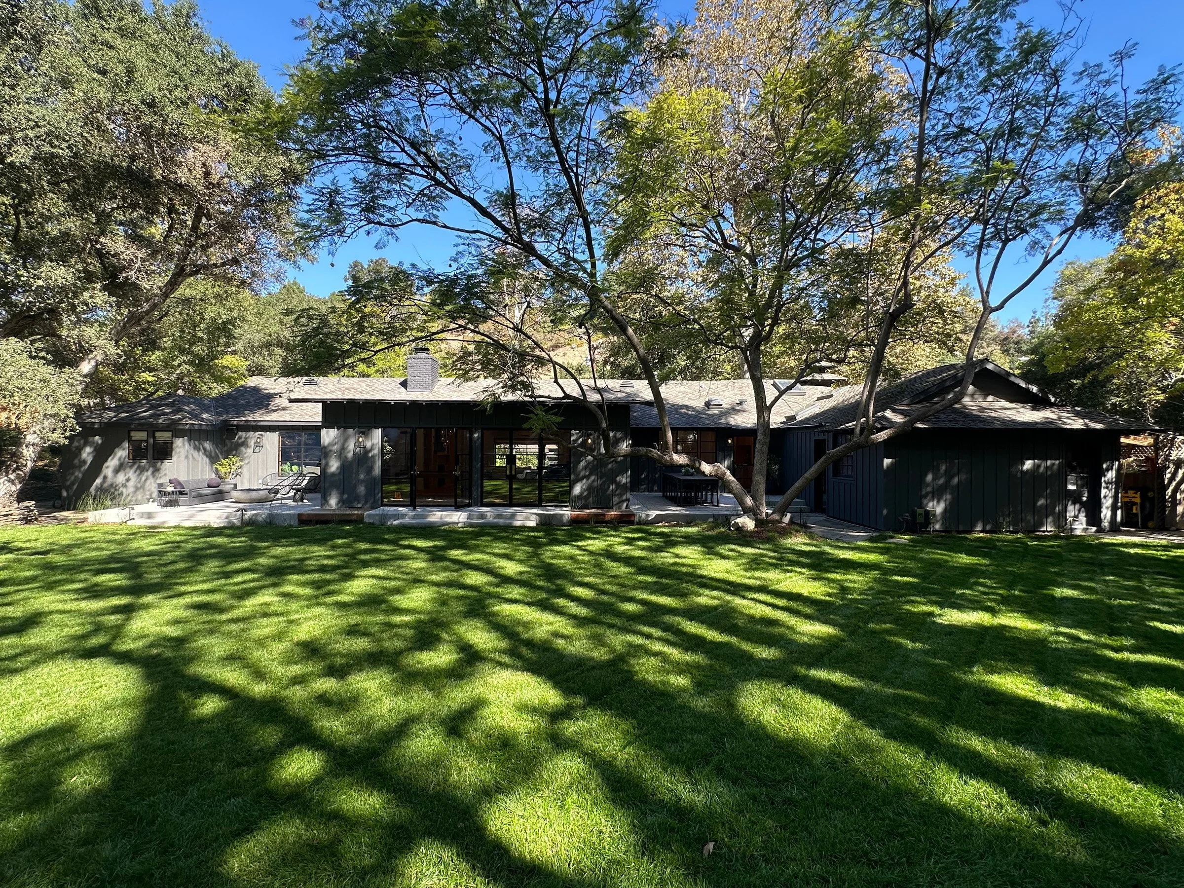 Rear facade across the expansive lawn. | PL-3803