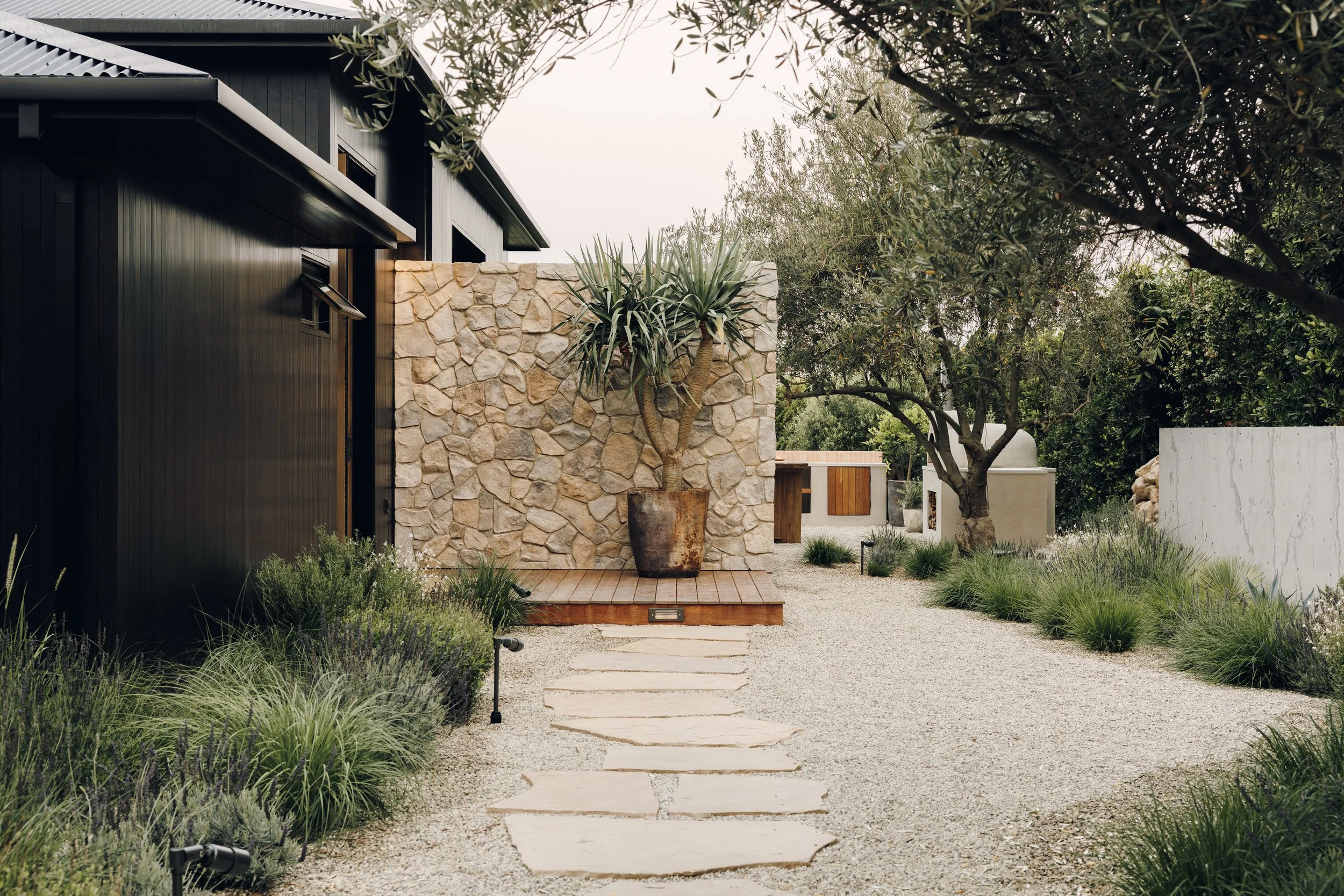 Wide garden entrance and stone wall