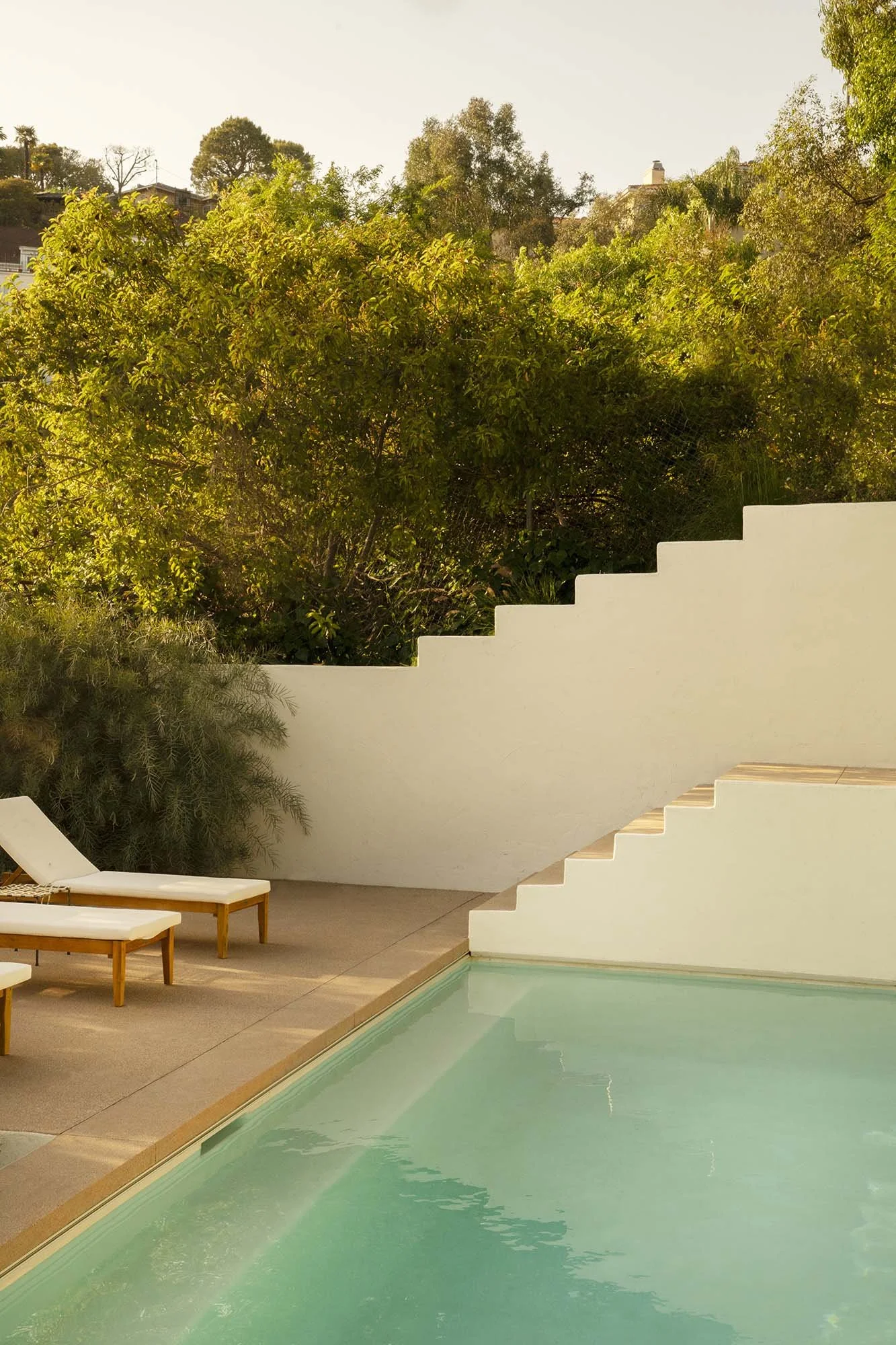 PL6014-042-pool-loungers-stepped-wall-treetops-vertical.jpg